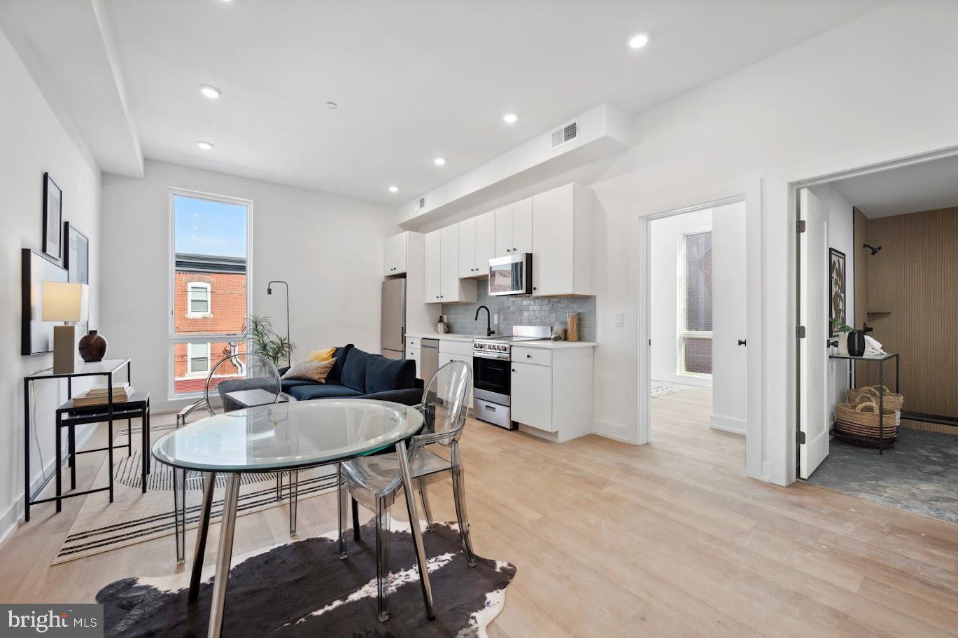 Welcome to Theatre Place, new luxury apartment living located in the Port Richmond area of Philadelphia. This four-story building is composed of 31 tastefully developed residential units - with elevator service to all floors - and offers security, a fitness center, in-unit laundry, optional parking, and more. Residents share access to a roof deck that will offer ancillary space for entertainment and relaxation, complete with unobstructed skyline views. 3037 Richmond Street is pet-friendly and designed to have a clean and minimal look while incorporating unique architectural details to enhance the quality of living. Featuring 1 and 2 BD units, each comes equipped with top-of-the-line selections. Offering a variety of different floor plans, residents have the option to select their optimal, open living standard. Kitchens feature quartz countertops, gleaming stainless steel appliances, white cabinetry, tile backsplashes, decorative pendant lighting, and garbage disposals. Each bathroom is spacious and offers tasteful flooring tile, storage vanities, black Delta fixtures, and stylish mirrors. Select two bedroom units have an additional full bathroom. The building amenities are bar none, offering secure parking spaces, a state-of-the-art fitness center, 24-hour surveillance, and keyless entry. There is ample bike storage. Landscaping by local Apiary Design. The Port Richmond location is in close proximity to public transportation which makes for a quick commute into Center City, University City, and other areas of Philadelphia. Don't miss this chance to live in a brand new, one-of-a-kind building in a neighborhood that offers all the best of Philadelphia! 1 BD units start at $1499/mo. 2 BD units start at $1799mo. Units available starting December 2023. Generally, first, last, and security are due upon move-in. $50 application fee per applicant. Parking available on a first-come, first-serve basis. $100/mo for uncovered parking. $45 flat water fee/mo. Some photos may be of a similar staged unit.