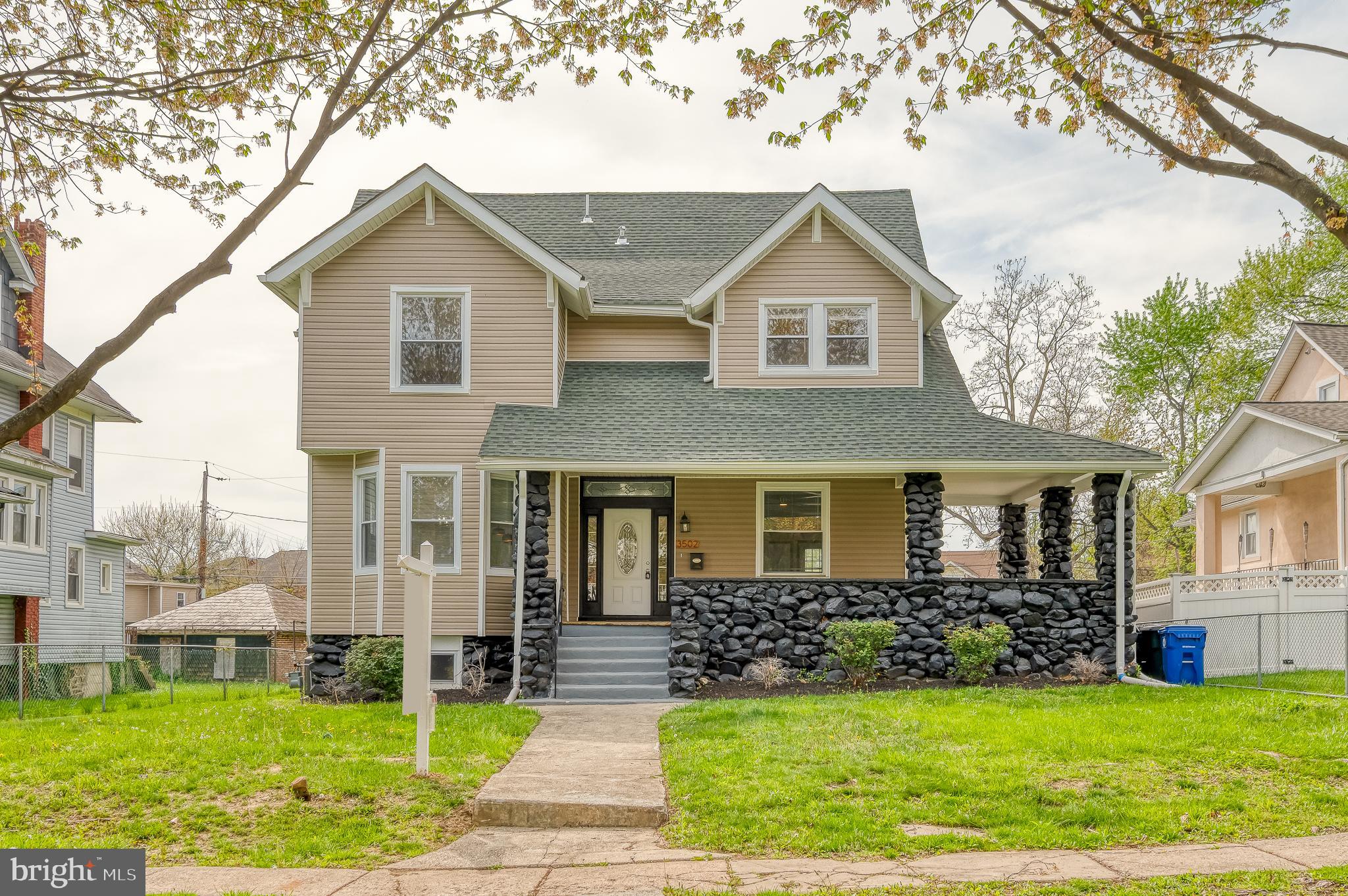 Located in the vibrant Dorchester neighborhood of Baltimore, this stunning 6-bedroom, 4.5-bath home offers the perfect blend of grand design and thoughtful comfort across four finished levels. From the welcoming front porch to the curated interior details, every inch of this home has been designed with both beauty and function in mind. The main level impresses with an open-concept layout, all-new flooring, and custom ceiling accents. The heart of the home is the show-stopping kitchen, centered around a 15-foot quartz island with waterfall finish—perfect for entertaining. You'll also find quartz countertops, sleek cabinetry, stainless steel appliances, and stylish lighting throughout. The dining area flows into a spacious living room where an electric fireplace, framed by accent stonework, adds warmth and sophistication. A designer laundry room completes this level with flair. Upstairs, the primary suite offers a tranquil escape, featuring a double vanity, detailed tilework, and a spa-like ambiance. Three additional bedrooms and another full bath are also found on this floor. Continue to the third level for two more bedrooms and a full bath—ideal for guests, work-from-home setups, or creative use. The finished lower level adds even more flexibility with yet another full bath, making it a great option for a media room, home gym, or additional living space. Outdoor highlights include two decks—one off the kitchen and one off the living room—perfect for relaxing or entertaining. A fenced backyard and private parking pad round out the impressive features. This one-of-a-kind home offers the space, style, and versatility today’s buyers are looking for.