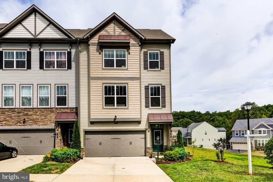 Instant equity! You will love this end unit townhome filled with an abundance of natural light. Offers unparalleled craftsmanship and exceptional amenities. Step inside to find gorgeous hardwood floors throughout the main floor, custom lighting, chandeliers, and beautiful windows to let in natural light. The kitchen has enough space for large gatherings and entertainment, features plenty of storage and energy-efficient stainless steel appliances, elegant pendant lights hang from the kitchen island. The master bedroom is stunning with a spacious sitting room with windows galore! Large walk-in master bath includes double vanity with designer flooring and shower tiles and upgraded frameless shower. Beautifully finished basement with 9ft. ceilings includes a half bath with walkout access. Spacious oversized deck is perfect for entertaining and offers stunning views of Colonial Forge. Includes Nest smart home package. Packed with tons of carefully hand-selected upgrades! This is a must-see. Will not last!