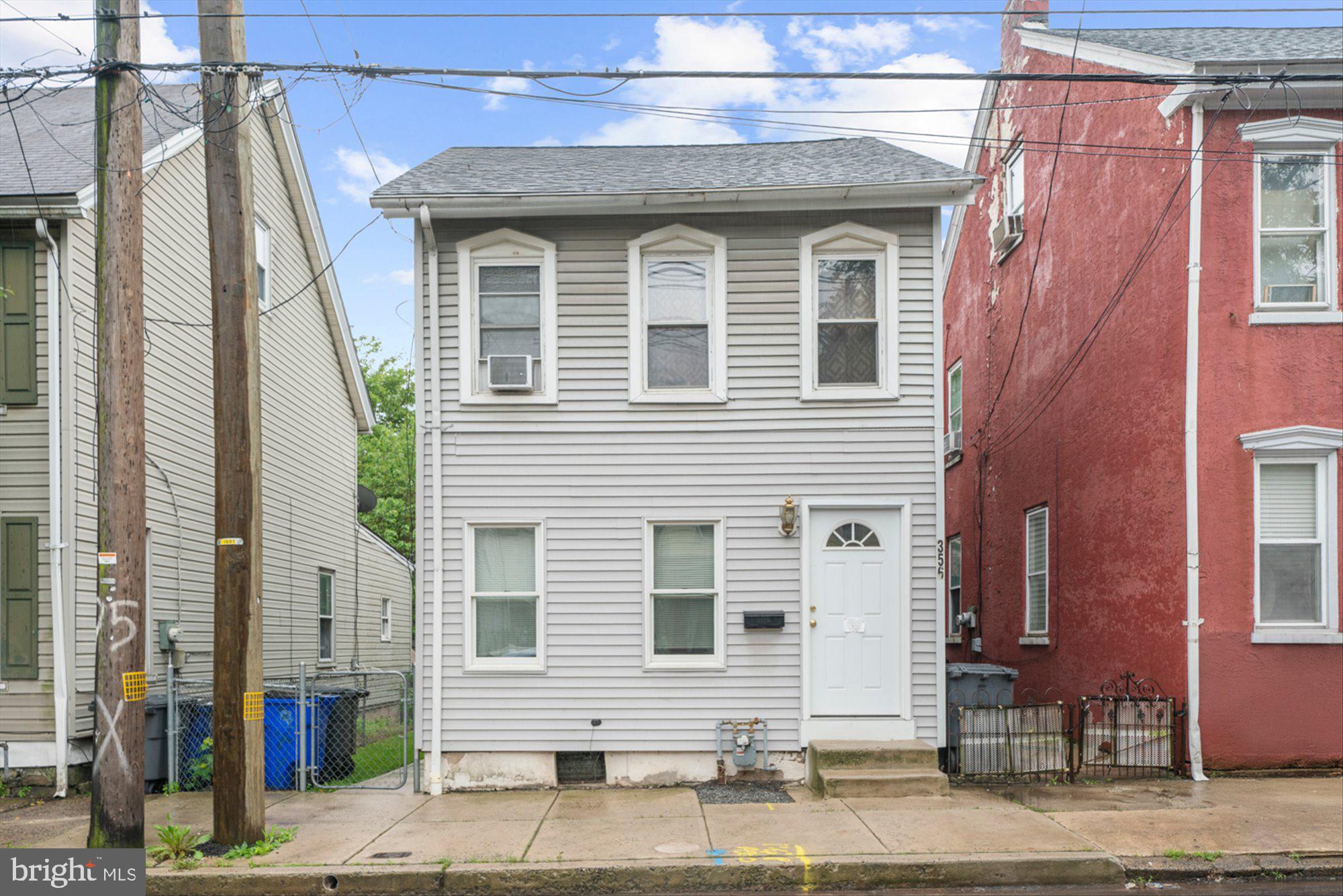 This well-maintained single-family home is the perfect opportunity for investors seeking a turnkey rental in the heart of Pottstown. Featuring 3 bedrooms and 1.5 baths, this property is thoughtfully laid out with functional living spaces and major system upgrades already completed. The main floor offers a comfortable living room, a dining area or office space, and a bright kitchen with access to a low-maintenance covered Trex deck. A convenient half bath is also located on the first floor. Upstairs, you'll find two bedrooms and a full bathroom. The third-floor bedroom is complete with a mini-split system for year-round comfort. Key upgrades include a new tankless water heater, updated HVAC system, new roof, modern plumbing and electrical systems, and the mini-split unit—ensuring peace of mind for years to come. The home also features alley-access parking for two vehicles. Currently tenant-occupied, this property offers immediate income potential with minimal upkeep required. Don’t miss your chance to add this solid performer to your portfolio!