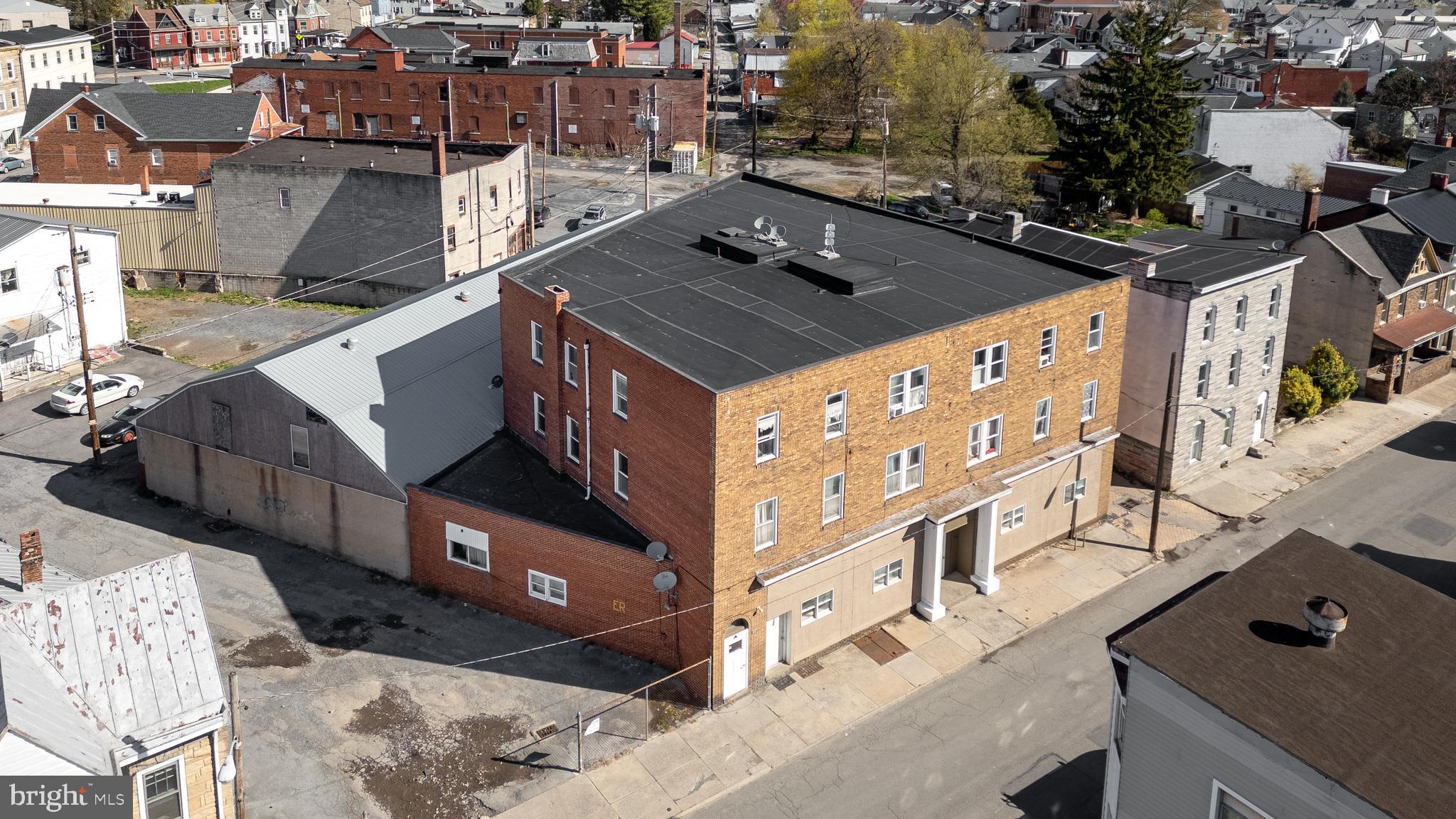 Prime Investment Opportunity: 17-Unit Apartment Building in Lewistown, PA
This fully updated 17-unit apartment building offers over 15,000 square feet of income-generating space in the heart of Lewistown, PA. The property includes a versatile mix of 1, 2, and 3-bedroom units designed to meet diverse tenant needs, along with a 5,000+ square foot attached garage featuring 17 dedicated parking spaces and ample storage potential. Two on-site laundry rooms enhance tenant convenience while generating additional income.
The property has undergone several upgrades to maximize value and appeal. Two units have been converted into spacious 3-bedroom apartments, boosting rental income, while a 17th unit was added at street level for additional revenue. Energy-efficient LED lighting has been installed throughout the common areas, and new entrance doors with advanced access control systems enhance security and convenience for tenants. A remote-access camera system ensures superior safety, and several units have been updated with refreshed kitchens, bathrooms, and flooring, making them fully functional and rent-ready.
With future potential to convert the garage into rentable storage units, add tenant amenities, or add an 18th unit, this property offers room for growth and increased revenue. Located in a high-demand rental market, this turnkey investment provides immediate cash flow and long-term potential, making it an exceptional opportunity for both seasoned investors and those looking to diversify their portfolios.