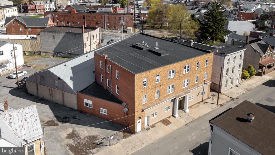 Prime Investment Opportunity: 17-Unit Apartment Building in Lewistown, PA
This fully updated 17-unit apartment building offers over 15,000 square feet of income-generating space in the heart of Lewistown, PA. The property includes a versatile mix of 1, 2, and 3-bedroom units designed to meet diverse tenant needs, along with a 5,000+ square foot attached garage featuring 17 dedicated parking spaces and ample storage potential. Two on-site laundry rooms enhance tenant convenience while generating additional income.

The property has undergone several upgrades to maximize value and appeal. Two units have been converted into spacious 3-bedroom apartments, boosting rental income, while a 17th unit was added at street level for additional revenue. Energy-efficient LED lighting has been installed throughout the common areas, and new entrance doors with advanced access control systems enhance security and convenience for tenants. A remote-access camera system ensures superior safety, and several units have been updated with refreshed kitchens, bathrooms, and flooring, making them fully functional and rent-ready.

With future potential to convert the garage into rentable storage units, add tenant amenities, or add an 18th unit, this property offers room for growth and increased revenue. Located in a high-demand rental market, this turnkey investment provides immediate cash flow and long-term potential, making it an exceptional opportunity for both seasoned investors and those looking to diversify their portfolios.