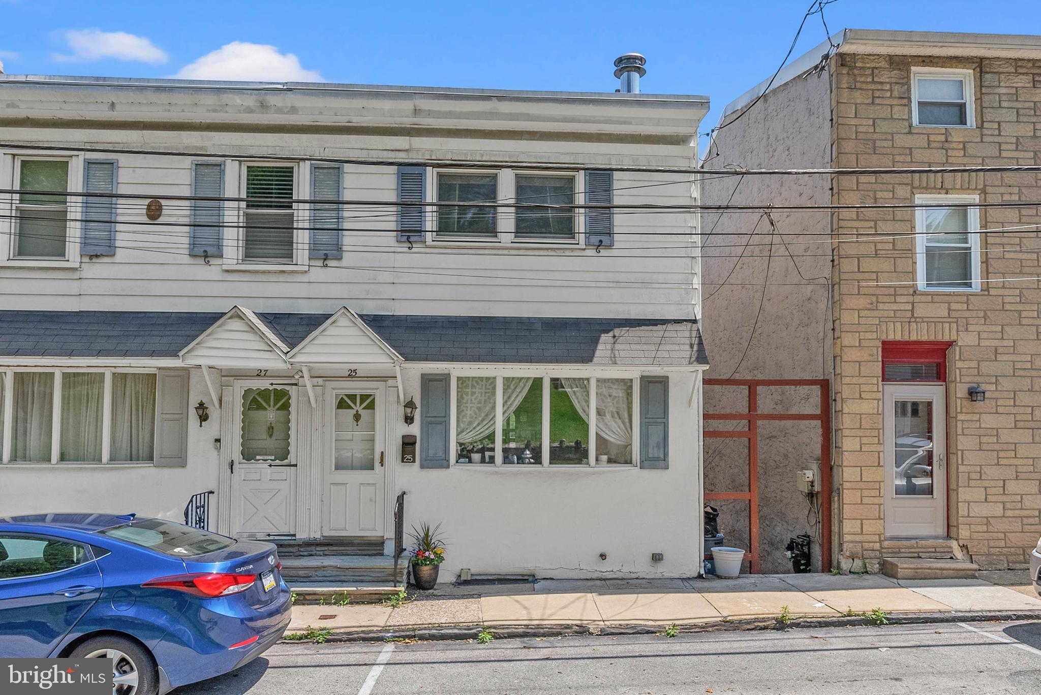 Tucked away in Balla Cynwyd's sought-after Belmont Hills neighborhood, you'll find 25 Jefferson St. This updated home offers 3 bedrooms, 2 full bathrooms, multiple scenic outdoor spaces, placement in the award-winning Lower Merion School District, and a fantastic location across the river from Main St Manayunk. Stepping inside, hardwood floors stretch across the bright, spacious living room that is anchored by a fireplace mantel and filled with natural light from an expansive window. Past the center staircase, you're led to the large, open, and airy kitchen and dining room. The kitchen has a full suite of appliances, including a dishwasher, while the sunlit dining room has another fireplace mantel. Indoor/outdoor entertaining is made easy with patio doors that open to a rear deck showcasing picturesque treetop views, perfect for summer barbecues or relaxing with a good book. Up on the second level, the bright primary bedroom has its own deck and a custom closet. A full bathroom and a second spacious bedroom are off the hall. Down on the home's lower level, there's a third bedroom that could act as a flex space, a large full bathroom with the laundry, and a huge storage room. The final outdoor space is a spectacular rear yard with a covered paver patio, and a grassy area that's sure to be a popular spot for hanging out with friends and family all summer long. 25 Jefferson St's prime location is just off Belmont Ave and I-76. Popular shopping centers are a short drive away, and neighboring Manayunk has tons of restaurants, shops, and entertainment to explore. Schedule your tour today!