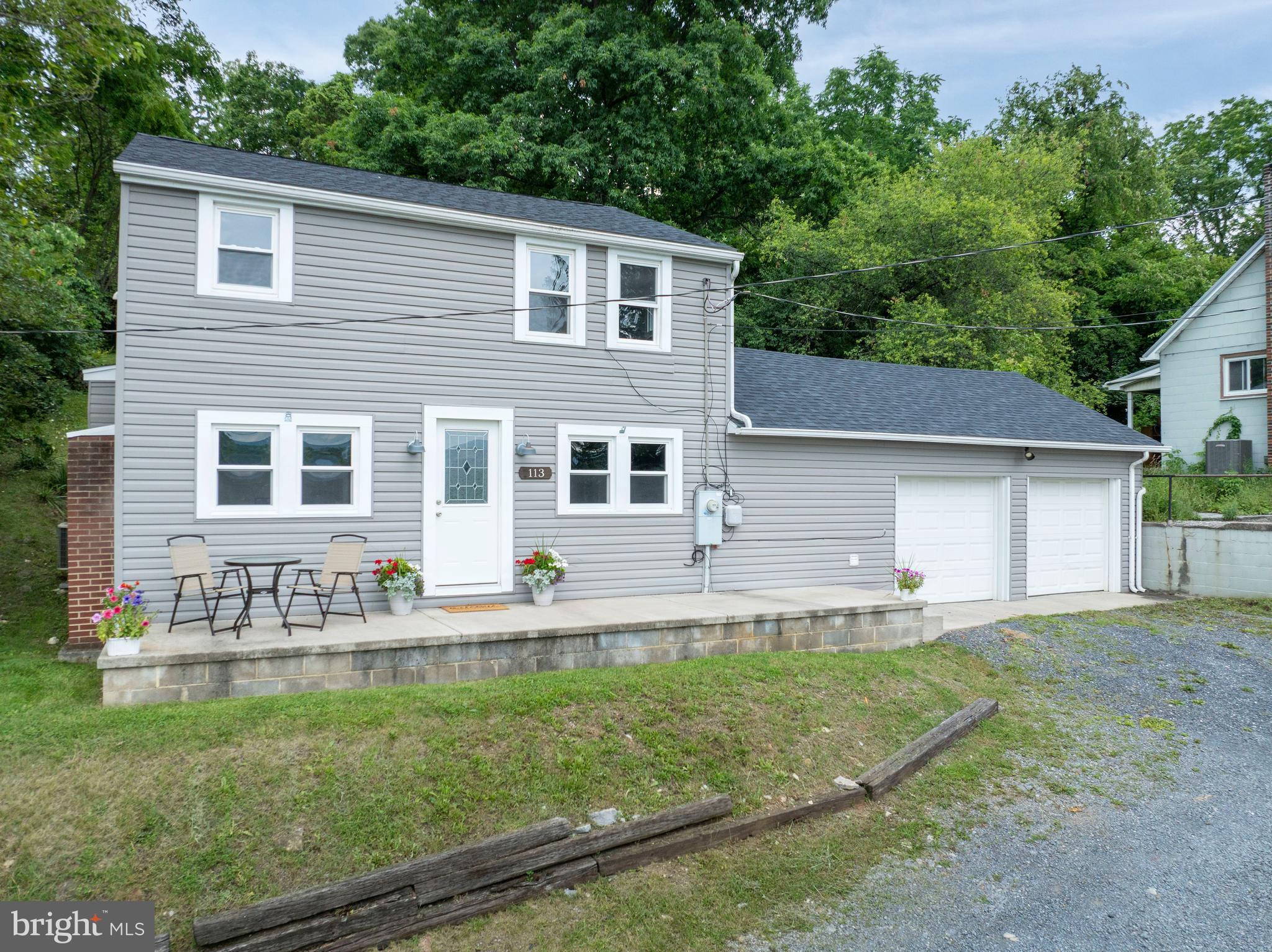 Welcome to 113 Lee Street, a great home with an even better view! This sweet home has 3 bedrooms and 1.5 baths plus tons of recent updates! A newer roof (2022), water heater (2023), brand new carpet and fresh paint greet you when you step inside. You'll appreciate the convenience of a large garage with 2 separate automatic doors and entering the home through the flex space that would make a wonderful mudroom. Main level laundry and a half bath add even more practicality to the floorplan. Enjoy a large kitchen that connects to the dining area to keep conversation flowing! The living room stays light and bright with well placed windows. Head upstairs to find all 3 bedrooms and the modern full bath. Outside, you'll find a nice side yard as well as ample space in the upper back yard to sit around the fire pit and unwind. Schedule your private tour today for 113 Lee Street!