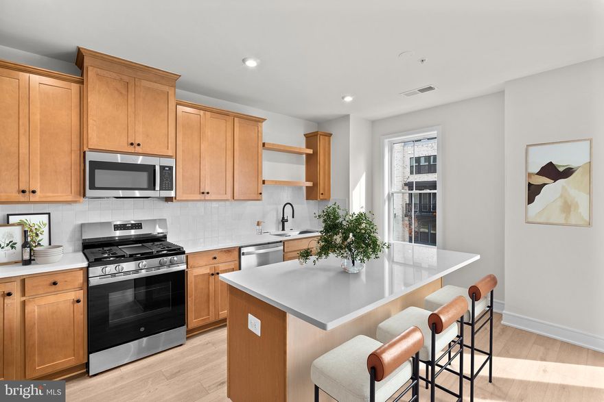 Discover a NEW TOWNHOME-STYLE CONDOMINIUM by Van Metre Homes is available for you to call home IMMEDIATELY. Nestled within the Broadlands community, this prestigious Collier 24-R1-RT floorplan spans 2,056 finished square feet across 5 levels.  Experience the Collier 24-R1-RT – Homesite 181 at Demott & Silver—a one-car, rear-load garage condominium with three bedrooms, two full bathrooms, and two half bathrooms. Designed for elevated, low-maintenance living, this floorplan blends townhome-style comfort with everyday convenience. Offering an entertaining rec room, a primary suite with dual walk-in closets, a spacious rooftop terrace and deck on the second level, making everyday moments feel effortless. Step inside and be greeted by an impeccably designed living space boasting 9' ceilings and sprawling luxury vinyl plank flooring. The kitchen boasts upgraded cabinets, quartz countertops, stainless-steel appliances, and a central island. The impressive primary suite has dual walk-in closets and a lavish 4-piece bathroom replete with double sinks and an oversized, frameless shower enclosure featuring a built-in seat. Venture to the top level, where two additional bedrooms await alongside a well-appointed full bathroom. Meanwhile, the lower level offers a spacious, multipurpose rec room, a convenient half bathroom, and internal access to the private garage. But that is not all! Embrace the allure of urban living with a touch of luxury as you entertain guests or savor tranquil moments on the breathtaking rooftop terrace, where panoramic vistas await. Being a new build, your home is constructed to the highest energy efficiency standards, comes with a post-settlement warranty, and has never been lived in before! Take advantage of closing cost assistance by choosing Intercoastal Mortgage and Walker Title. Schedule your appointment today! ----- Discover Demott & Silver, Van Metre’s exceptional community of townhomes and townhome-style condominiums nestled within the master-planned Broadlands community. This sought-after neighborhood offers unparalleled convenience with walking distance access to Metro’s Silver Line and the area’s most desirable amenities. Residents relish in a host of top-notch amenities across Broadlands, including a clubhouse, fitness center, three pools, tennis courts, vast green spaces, and extensive hiking and biking trails. With shopping, restaurants, Metro’s Ashburn Station, a bus stop, and nearby commuter routes at your fingertips, Demott & Silver is set to become the epitome of a superior community in Broadlands. ----- *Other homes sites and delivery dates may be available. Pricing, offers, and availability are subject to change without notice. Images, renderings, and site plans are for illustrative purposes only and may not reflect actual homes or features. Some images and renderings may depict interior designs created in collaboration with AI or may represent a similar home. Additional terms and conditions may apply. Please see a Van Metre Sales Advisor for details.