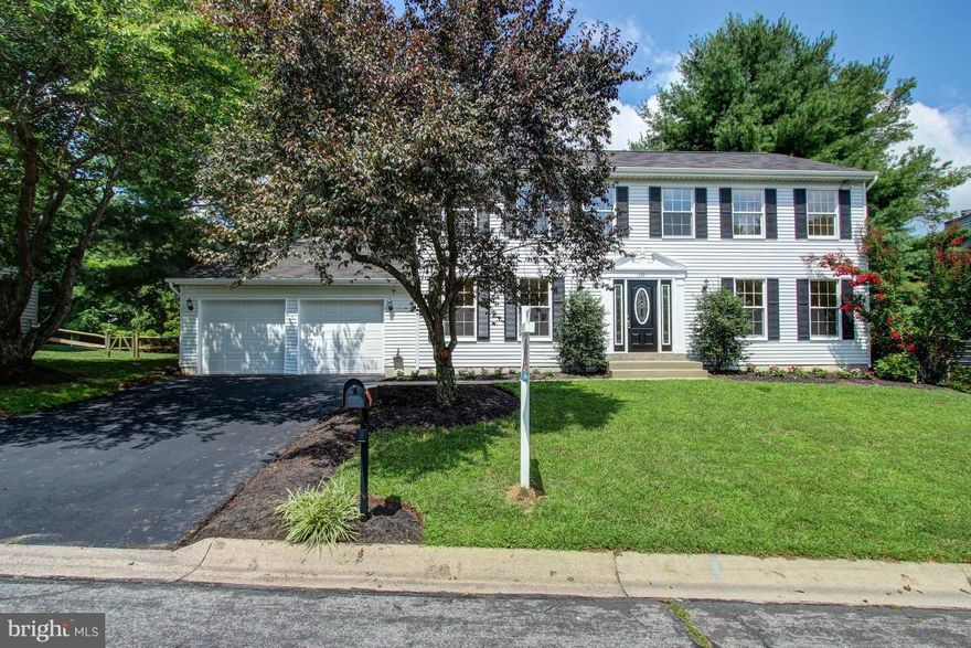 A charming home with updated kitchen, 3 finish levels with open floor plan. Main level has a gourmet kitchen with granite counter tops.Center Isle with JennAir cooktop. Hardwood floors, formal dinning and living room. Spacious rooms. Master suite with walk-in-closet and new carpet.Finish basement with Cedar closet, half bath and bar. Tiered deck overlooking private yard with patio. MUST SEE!!