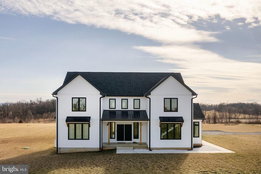 Welcome to this like new(2023) Custom Built Modern Farmhouse featuring over 5000 finished sq ftg situated on 2 Unrestricted acres that is surrounded by farm land in beautiful Jefferson County.  Home  offers an open floor plan with lots of natural lighting with 9ft ceilings on the main  and the living room ceiling flows 2 stories tall that is accented by a gas fireplace and LVP flooring.   Has a rare 1st floor Master Bedroom with trayed ceiling & fireplace with Master Bath that has a tiled walk in shower and a freestanding Vanity Art tub; not to mention a huge walk-in/walkthrough closet.   Kitchen  comes with all matching Whirlpool appliances, 42" cabinetry, soft close drawers, walk-in pantry , Luxury Quartz counter tops and oversized Island that adjoins the Dining area.  Venture up the top of the line  staircase with custom designed railings to reach the upper bedrooms as well as a large sitting area.  Here you will find another Master Bedroom featuring a trayed ceiling and private full bath.  Head down the upper walk way and you will find 2 more large bedrooms separated by a large Jack & Jill Bathroom.  Don't miss out on the finished lower level(basement); it offers a Huge recreation room ideal for large gatherings and a possible 5th bedroom/bonus room(lacks proper egress).  Here you will find the 4th full bath and a private hidden finished room(behind book shelf).  You can exit the basement via the walk up stairs to the side yard and head down the walkway and enjoy a cook out at the BBQ Pit.  This gorgeous custom home was designed for the animal lover in mind as it has  a dog shower on the main level just off the garage area.  This house delivers on all levels  inside and out !