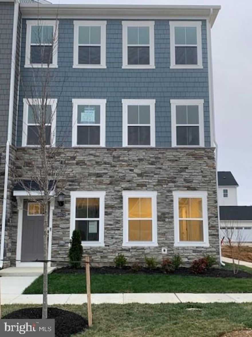 Immediate, Move-in Ready Home!
This amazing Ellicott townhome has 2,736 sq. ft. with 3 bedrooms, 3 full baths and 1 half baths.  Situated on the first floor, two versatile flex spaces on main level can be used as a recreation room for family games, comfortable lounging, and home office.  Enhancing the convenience and functionality of the first level is a half bathroom.  You will have excess to the backyard for outdoor living space. On the second level the kitchen is equipped with an oversized center island that doubles a breakfast bar, sparkling granite countertops, stainless steel appliances, designer cabinetry and a roomy pantry.  Ample countertop space that provides plenty of room for food prep and casual meals.  The Dining room is fit for casual weekend brunches and upscale celebrations alike.  The sun-drenched family room flows to the kitchen to make everyday living a breeze, and you will find a powder room for convenience on this level.  The third level owner’s suite features a spa-inspired bathroom with a glass-enclosed shower with built-in seating, double vanities and a generous walk-in closet, plus an optional tray ceiling.  The owner’s bathroom has dual sinks, and a generous glass-enclosed shower make mornings simple.  A separate commode area adds an extra layer of privacy to the en-suite bathroom.  Built-in shelving optimizes this spacious walk-in closet for organizing wardrobes, shoe collections, accessories and linens.  Two secondary bedrooms are situated down the hall from the owner’s suite.  There’s a full bathroom shared between the secondary bedrooms.   The laundry room is conveniently located among the bedrooms on the second floor, which helps simplify household tasks.
The photos provided are for illustration purposes only, and not of actual home.
Homeowners will enjoy an onsite community center, swimming pool, exercise room, dog parks, tot lots, and walking trails.  St. Charles Highlands is near great shops, restaurants, parks, and golf courses for outdoor activities. The Capital Beltway offers easy access to Washington, D.C.