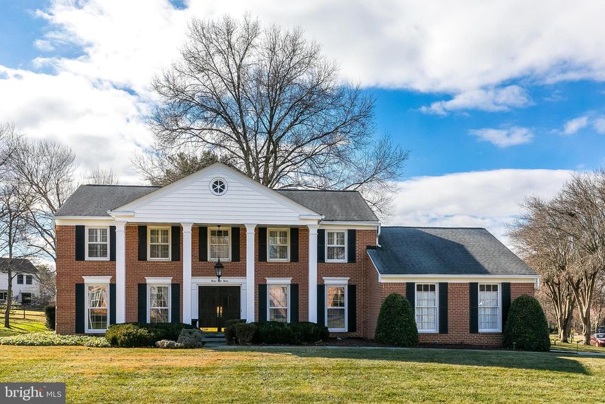 Set on a prominent corner lot in Potomac Commons, 12812 Deep Spring Drive makes an immediate impression with great curb appeal and a welcoming presence. Inside, a dramatic two-story entrance foyer is anchored by a gracious curved staircase—an elegant introduction to the home’s thoughtful layout.

The main level offers beautifully defined living and dining rooms filled with natural light, along with a private library featuring a full wall of custom built-in shelving—perfect for work or quiet retreat. At the heart of the home, the updated eat-in kitchen shines with high-end appliances, custom cabinetry, and easy access through a door to the back patio for seamless indoor-outdoor living. The adjacent family room is designed for comfort and entertaining, complete with a raised-hearth wood-burning fireplace, random-width pegged hardwood floors, and a wet bar nearby.

A powder room and a convenient laundry/mudroom—featuring doors to the side yard and garage—round out the main level. The large side-load two-car garage adds everyday ease.

Upstairs, you’ll find four well-sized bedrooms, a hall bath, and a spacious primary suite with a walk-in closet and an updated en-suite bath. The unfinished lower level provides abundant storage and a blank canvas ready for your vision. Recent updates throughout enhance both style and function—this is a home that’s ready to enjoy and easy to personalize.