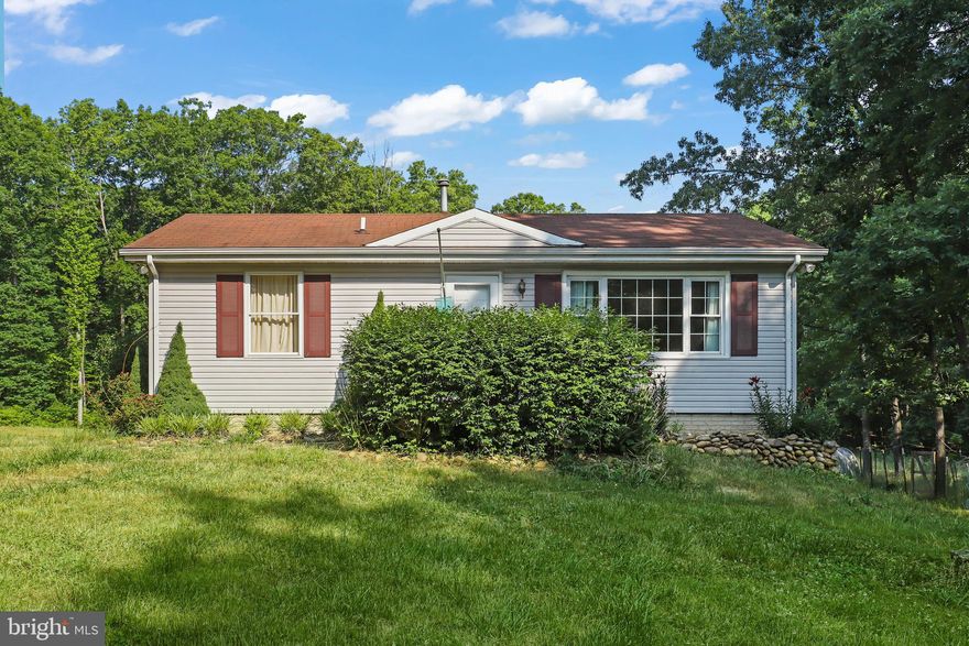 This charming 2-bedroom, 1-bath home is nestled on an expansive 5.39+ acre property, offering a serene and private living experience or farmette!   2 bedrooms are upstairs and 1 full bath with a lower level that is finished and can offer a 3rd possible den/BR option.    Oversized 2 car garage is complete with epoxy floors and can be used for car enthusiast or for additional storage.   Endless opportunities for outdoor activitiesk, including livestock containment areas and lot is practically fully fenced with a stocked pond!  Zoned for Agricultural use, this attractive lot is appealing for the future owner who wants to expand existing home or use as secondary home for business or farming options.