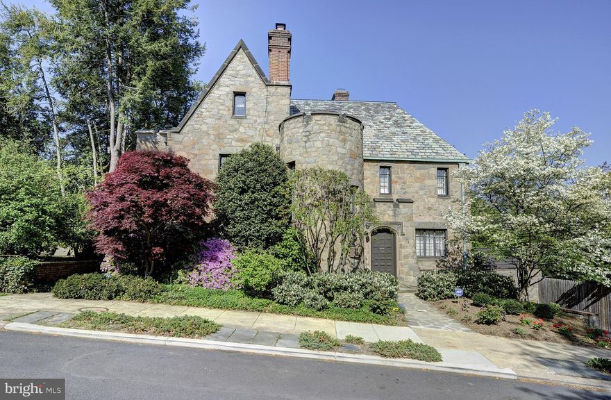 First time on the market in over 40 years. Meticulously maintained and renovated Norman revival with exquisite original details including arched doors/windows, leaded glass & carved stone fireplace. Well-proportioned rooms with abundant light. Expansive and very private rear garden- lush green spaces, patios and pool. Recent renovations: new elevator, 2 Baths, 2 a/c units. Estate- sold  as is .