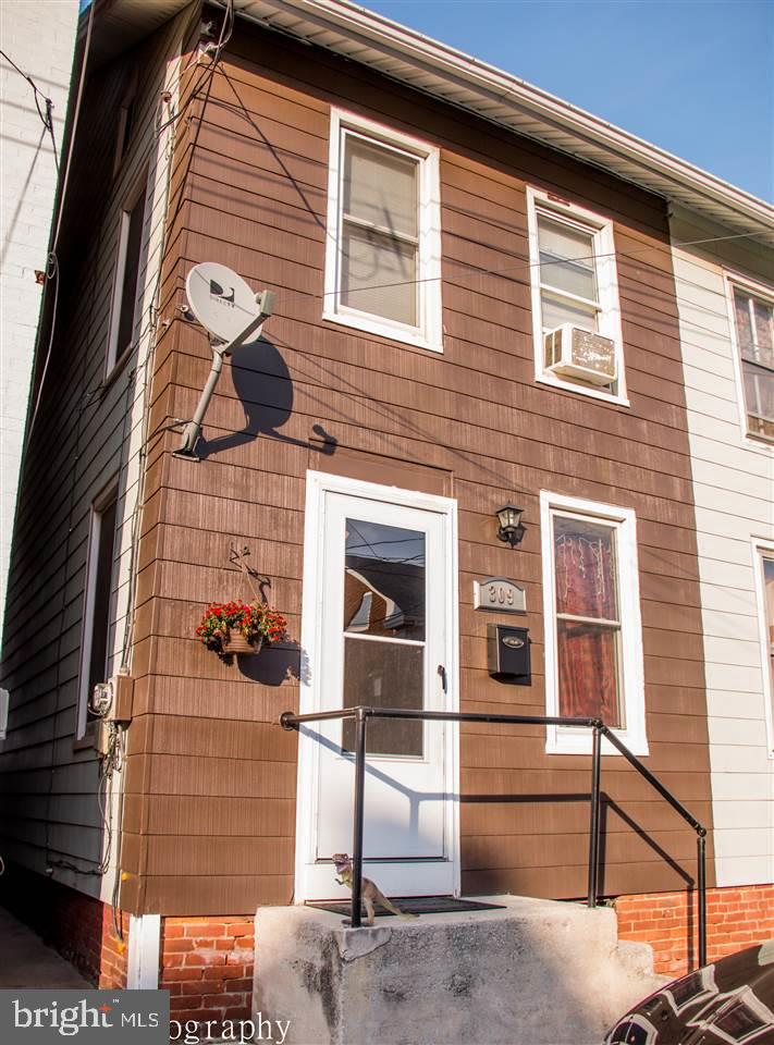 Seller's are willing to provide full seller's help with a full price offer, approximately $5,100 in closing help. Fully renovated home in 2011 with all new kitchen cabinets, new flooring, new carpet, large remodeled bath, fenced yard and electric, and replacement/high efficiency windows and dry locked basement. Seller's recently added fantastic stamped concrete patio, also repaint shed and home. VERY well maintained! 1 Parking Pad behind home.