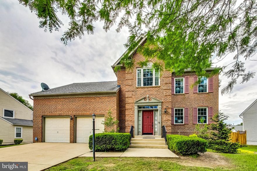 Exceptionally maintained brick colonial in Perrywood community is ready for new owners. This one-owner brick home is just the gem you are looking for! From the well appointed front walk, you'll enter in the foyer area to hardwood floors and a spacious elevator parlor with a large coat closet and powder room. At the rear of the home, you'll find both a separate dining space with modern chandelier, bright white cabinets with new hardware, stainless steel appliances, eat in kitchen space leading to the comfortable living room with fireplace feature and a huge low-maintenance pvc deck out to a spacious fenced rear yard. Parking is easy with a two-stall attached garage, offering extra deep stalls for additional storage or workshop space.

Upstairs, you'll find new carpeted floors in all the rooms. Directly above the garage is a large bedroom/rec room/bonus room with a huge closet, and newly replaced skylights - Great as a second primary bedroom space, as a theatre room, or a kids play area! On the opposite end of the house, you'll find a spacious primary bedroom with newly renovated ensuite bathroom with double sink vanity. The walk in closet is custom fitted with Elfa Closet Systems. Two additional bedrooms can be found upstairs, including one with custom build in bookcases and window seat - perfect for a child's bedroom or home office, and another custom closet system. Both bedrooms have new LED flush mounted ceiling lighting with nightlight mode - great for guests and kids. The hall bathroom is recently renovated, with new lighting, vanity, flooring, and mirror.

The lower level of the home offers so much room for your expansion - a full height walk-out basement with egress windows, a rough-plumbed bathroom, and washer/dryer hookups. Can be converted to an in-law suite, additional bedroom spaces, or additional recreation & storage space.

All systems are up to date - with updated roof, HVAC, hot water heater and windows all having been replaced in the last 5 years. Located directly across from the walking, biking trail, with easy access to 202 and 495, this home is a dream come true!