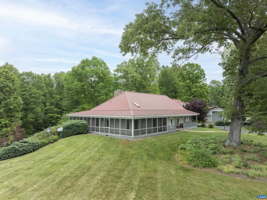 Custom built home situated on 101 private acres in beautiful Madison County, just minutes from the town of Orange. The four bedroom and 3.5 bath home was built in 2000, and offers a fabulous great room with stone fire place, vaulted ceiling, and custom kitchen. Most of the living space is on the main floor, with elevator access to both the walk out lower level, and bedroom suite upper level. Other features include an attached sunroom/greenhouse, fireplace in the first floor primary bedroom, wrap around screen porch, second kitchen on the lower level, and a whole house generator. Property also has a large heated shop/garage with a half bath, and car lift, great for storing cars. The home sits beautifully on the land, which is professionally landscaped with mature plants and trees. access to the home is a paved driveway. Property is protected by a conservation easement.,Formica Counter,Glass Front Cabinets,Oak Cabinets,Fireplace in Family Room,Fireplace in Master Bedroom