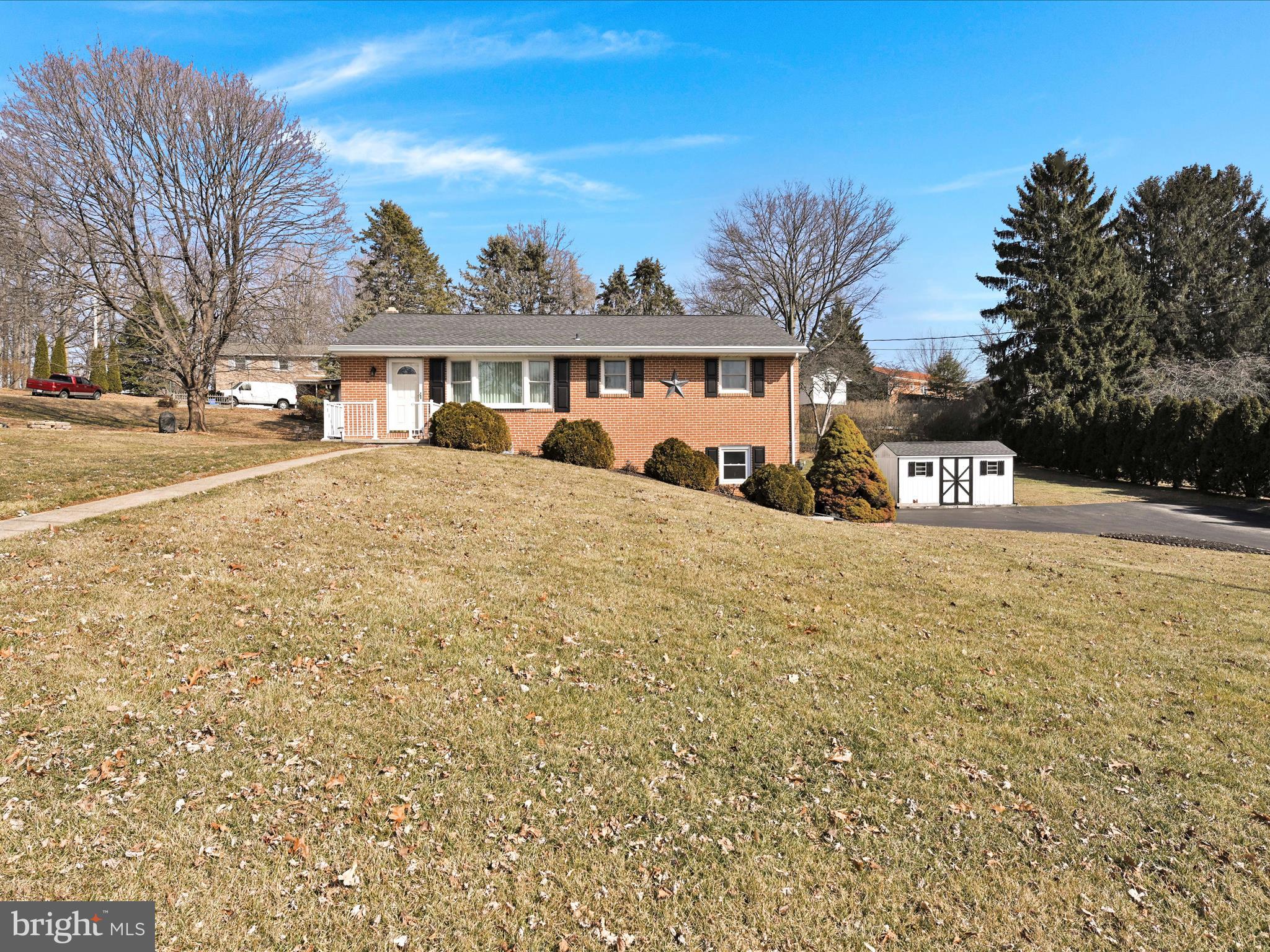 Welcome Home! This solid 3 BR, 2 BA brick rancher in popular Dallastown School District is waiting to be made yours! This home features an oversized 2-car garage, partially covered patio area with privacy fencing, newer Andersen windows, newer roof, boiler, water heater and Generex Generator. The living room has a bay window with custom window treatments that overlooks the front yard. The kitchen/dining area feature gas cooking, open to a private patio and include all appliances. Ceiling fans are in all the bedrooms and both bathrooms have had some updates. The finished lower level has a wood burning fireplace with a brick surround. The laundry/utility room include the washer and dryer. Outside you have plenty of yard and a shed for storage. Plenty of parking. Amazing location near shopping, schools and parks! Available for showings March 1st!