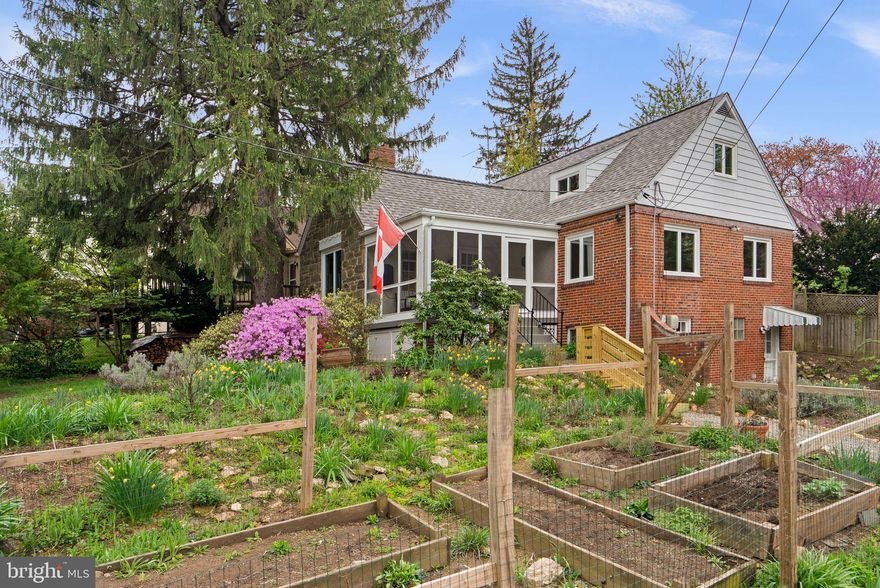 Perched high on a hill and surrounded by lush greenery, 314 Dale Drive offers a rare sense of privacy and tranquility, making you feel as though you are nestled in your own forest retreat.

A charming garden-lined walkway welcomes you home, bursting with seasonal beauty, including daffodils, azaleas, and perennial native plants, along with fenced vegetable beds ready for your next harvest. At the top, a freshly painted screened porch invites you to slow down and take in the peaceful, serene views of the gardens.

Inside, refinished hardwood floors from 2022 flow seamlessly throughout both the main and upper levels. The living room is filled with warmth and character, anchored by three stunning focal points: a wood-burning fireplace, large windows framing views of a majestic pine tree, and an open sightline to the beautifully renovated kitchen and dining space, completed in 2011.

The main level features two light-filled bedrooms with hardwood floors and a full bathroom thoughtfully renovated in 2011. Upstairs, you will find two additional bedrooms, including a spacious primary bedroom with a charming dormer window that adds both character and natural light.

The walk-out lower level offers exceptional versatility with its own entrance from both the home and driveway. This level includes a generous family room filled with natural light, a full bathroom added in 2018, a laundry area, and a dedicated workspace currently used for bike repair, complete with newly installed windows in 2026.

With three separate access points to the outdoors from the front porch, kitchen, and lower level, indoor-outdoor living comes naturally here.

The backyard is truly a peaceful oasis, centered around a stunning wood-burning cob pizza oven that serves as the heart of the space. Countless evenings have been spent gathered around the firepit making homemade pizzas, and this beloved feature will convey with the home, ready for its next owners to create lasting memories.