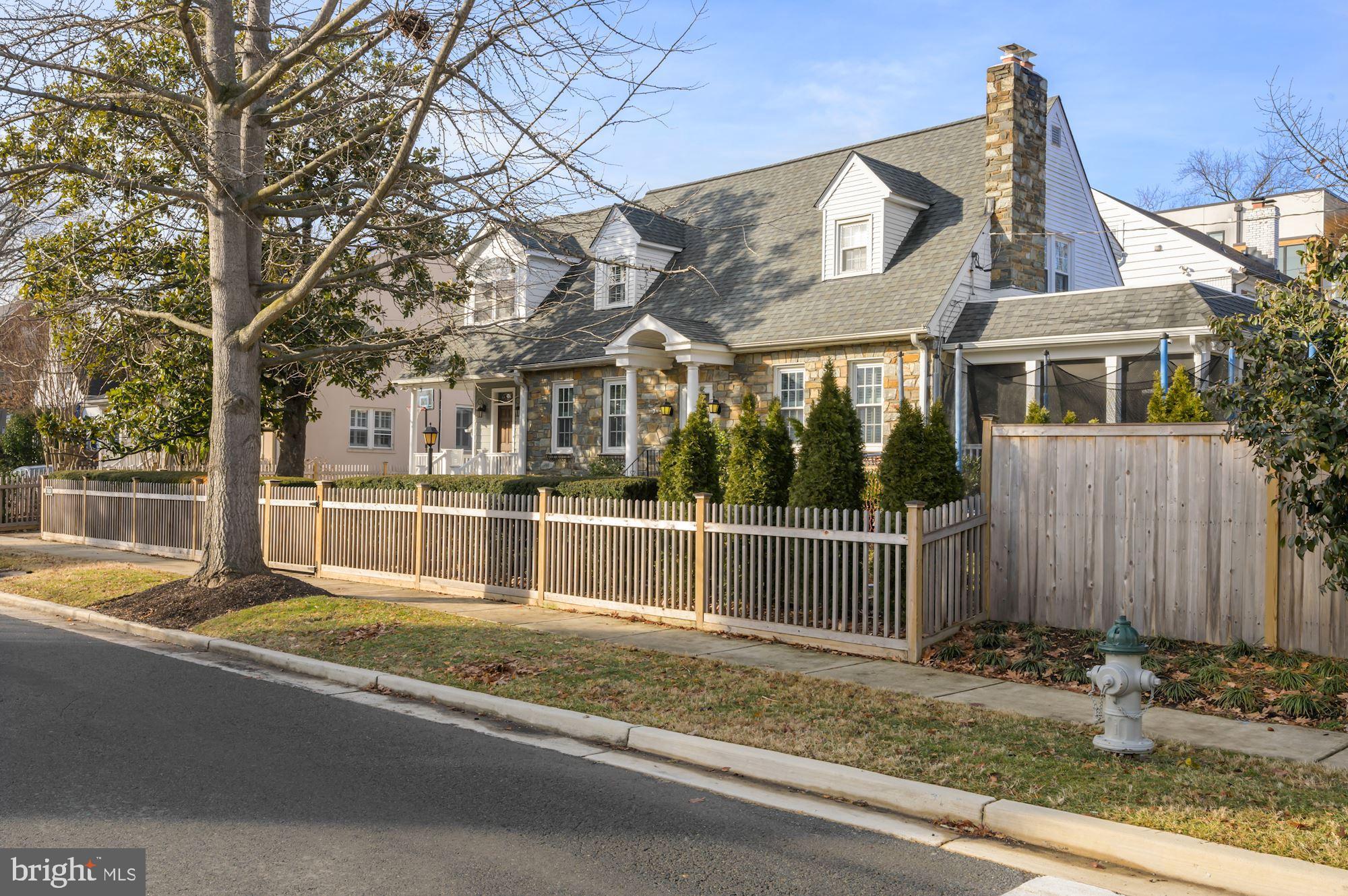 OFFERS ARE DUE MONDAY, FEB 14 AT 7:00PM. Edgemoor Club pool/potential tennis membership convey with Seasonal fee!
In the heart of tree-lined Edgemoor, just steps from downtown Bethesda, this handsome Cape Cod enchants with its face of fieldstone beauty and historic mood. Built in 1932, the home welcomes from its quiet corner of lilacs, hedge-rows, magnificent magnolia tree, and brick-lined drive.
Inside, sunlight highlights plantation shutters and stone-clad walls, while warmly-hued woods
guide your way to spaces for relaxation and rest. In the home’s heart, enjoy watching over morning activity in the great room with a vibrant gas fireplace from across the cobalt-colored island. Here, your ivory kitchen assists with savory meals using beveled, environmentally sustainable Quartz countertops, cabinets for storage and display, and professional grade appliances.
Outside, look forward to summers filled with yard games, while warm breezes are cooled within the enclosed patio. From the full-sized wine refrigerator, pour glasses of cheer for guests enjoying cozy conversation near the wood-burning fireplace. On more casual nights, select a read from the built-in entertainment center or host movie nights for little loved ones. At day’s end, four restful bedrooms and three and a half baths soothe. In the principal rooms enjoy main level accommodation - and separate covered porch entry - upstairs three bedrooms, including the primary suite, await. Here, your sitting nook lends comfort for recounting the day, while new garments find their home in a tucked-away closet. Also here, choose to refresh in the oversized glass shower or spend the evening soaking in bubbles. A private, fourth lower level bedroom features it's own full bathroom.
While on tour, ask about the home’s thoughtful security system, solar panels, and irrigation system, and note the convenience of an upstairs laundry. Nearby, meet friends for a day of shopping and bites in downtown Bethesda, or stroll to the metro where destinations throughout the Washington D.C. region await!