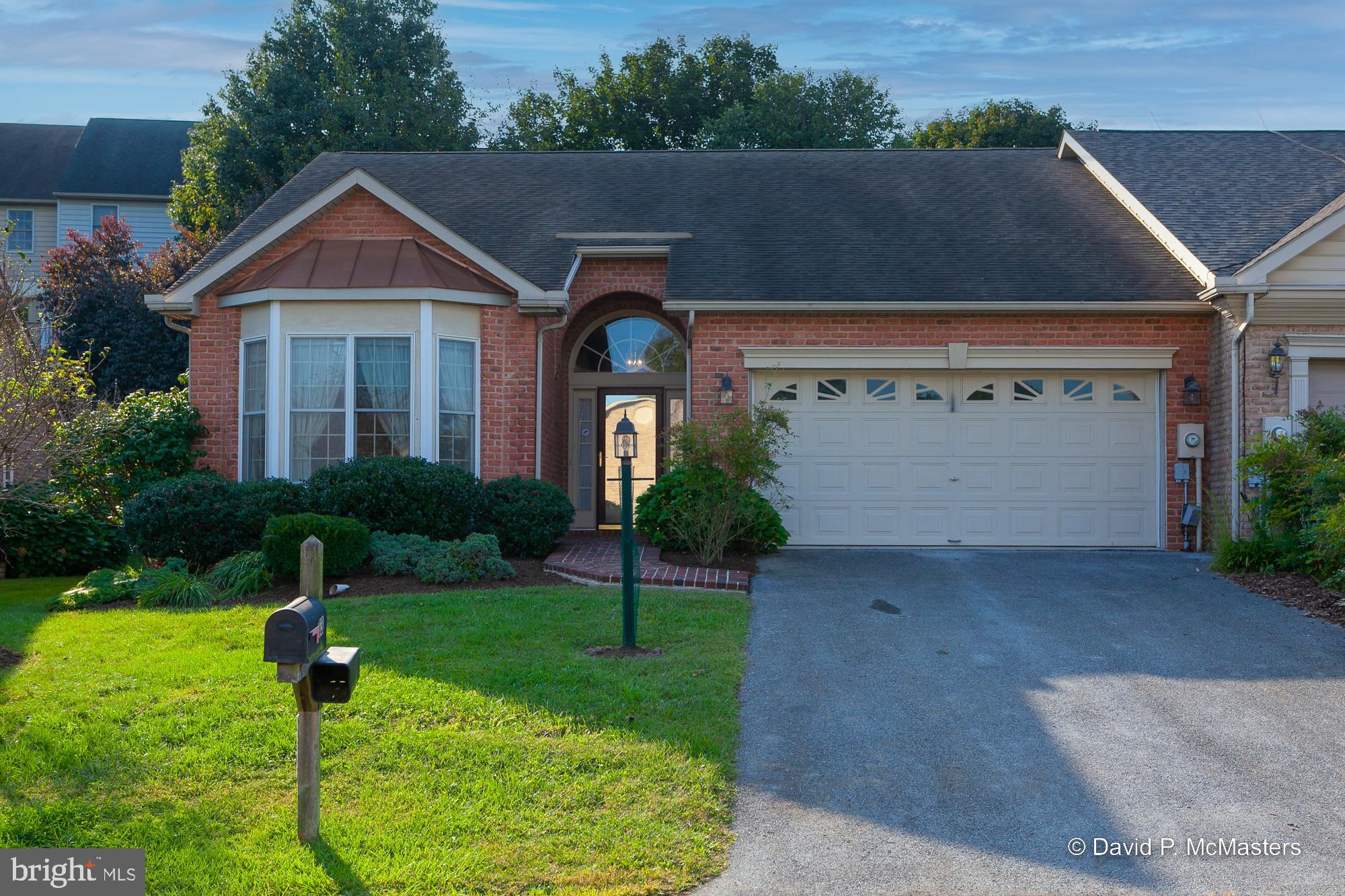 SELLER WILL REVIEW ANY OFFERS AT 2:00 PM ON THURSDAY, 9/22. Welcome to this modern, elegant, one level villa with dramatic vaulted and high ceilings, bay and Palladian windows, beautiful hardwood floors, custom window treatments, new carpeting, a fireplace, pass-through 2-sided breakfast bar, 2-car attached garage with automatic door, central vacuum, security system, and gorgeous recent den/office addition with beautiful built-in bookshelves, cabinets, and desk, which opens to the rear patio with an automatic electric awning. Enjoy low maintenance landscaping with minimal yard to maintain, lovely trees, shrubs and flowering plants, automatic sprinkler system for the back garden area (automatic gauge that was used to turn it on is missing), plus fencing in the rear and a side wall for privacy. Cable TV and high-speed internet are available. Spring Mills has an outdoor pool, tennis courts, and playground. Conveniently located 2 minutes to I-81 and plentiful locations to dine and shop.