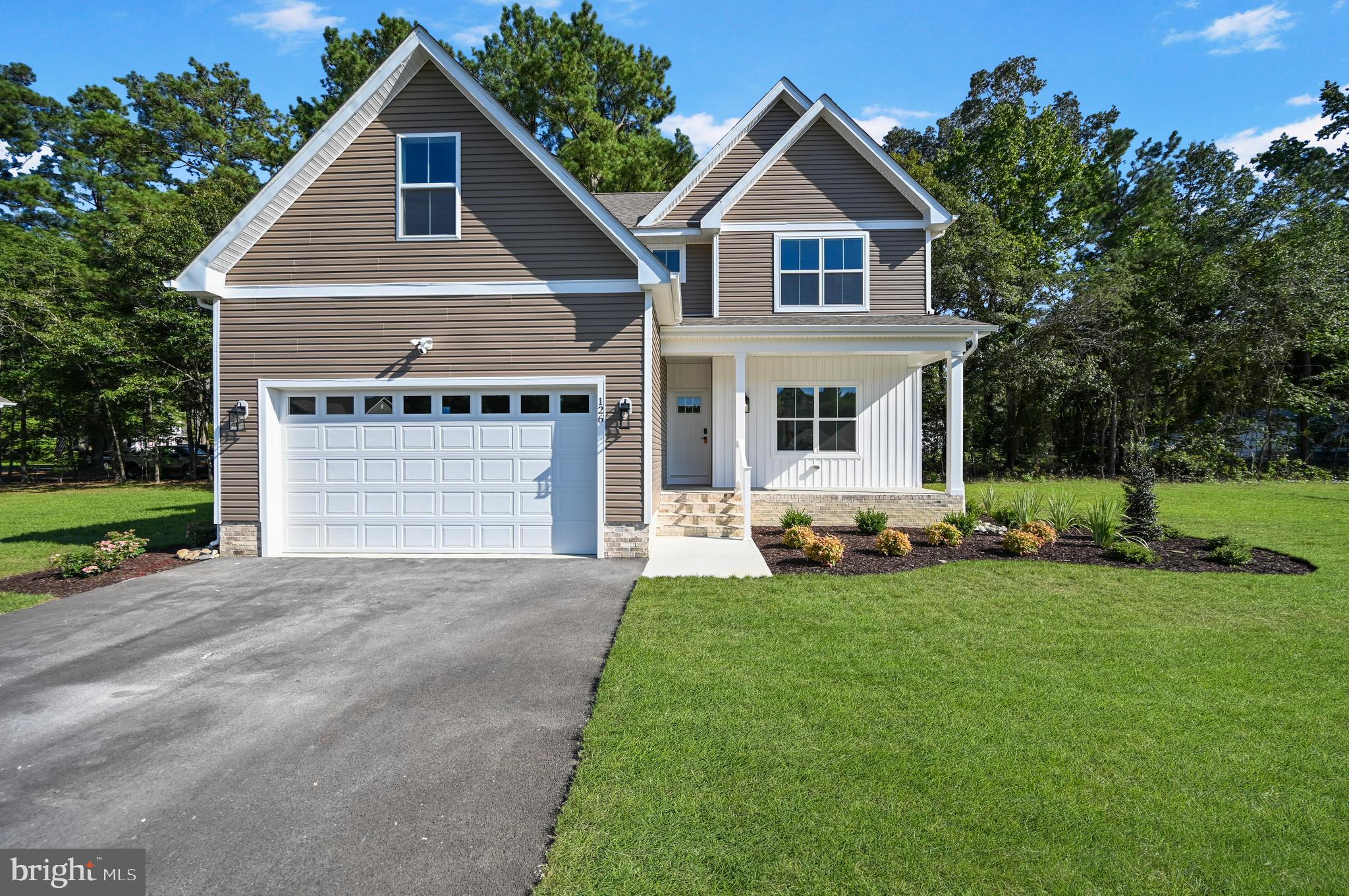 Welcome to this stunning 3-bedroom, 2.5-bathroom home in the desirable Holly Hill community of Fruitland, MD! With a low annual HOA fee of just $375, this home offers both comfort and style. Step inside to find an open floor plan with a chef-inspired kitchen, featuring a large island, quartz countertops, Fabuwood cabinets with self-closing drawers, stainless steel appliances, and a chic tile backsplash. The inviting living room is complete with a cozy gas fireplace, perfect for relaxing evenings. A convenient half bath is located on the first floor. Upstairs, you'll find the spacious master suite, complete with a walk-in closet and a beautifully tiled shower. Two additional bedrooms share a full bathroom with a tile shower, and the laundry room is also conveniently located on the second floor. A bonus room above the garage offers endless possibilities for a home office, playroom, or entertainment space. Enjoy the outdoors on the maintenance-free back deck made of TimberTech decking, perfect for entertaining or relaxing. Builder upgrades include CertainTeed siding, IKO Cambridge shingles, MI V3000 series windows, an insulated garage door, and a Ring Home Package for added security. The home also boasts a stylish Craftsman trim package, durable LVP flooring with a lifetime warranty, wood shelving in the closets and pantry, and tile accents throughout. The curb appeal is enhanced with a blacktop driveway and a professionally landscaped bed package. This home truly has it all—modern amenities, quality finishes, and a fantastic location in a sought-after community. Don’t miss the opportunity to make this beautiful home yours!