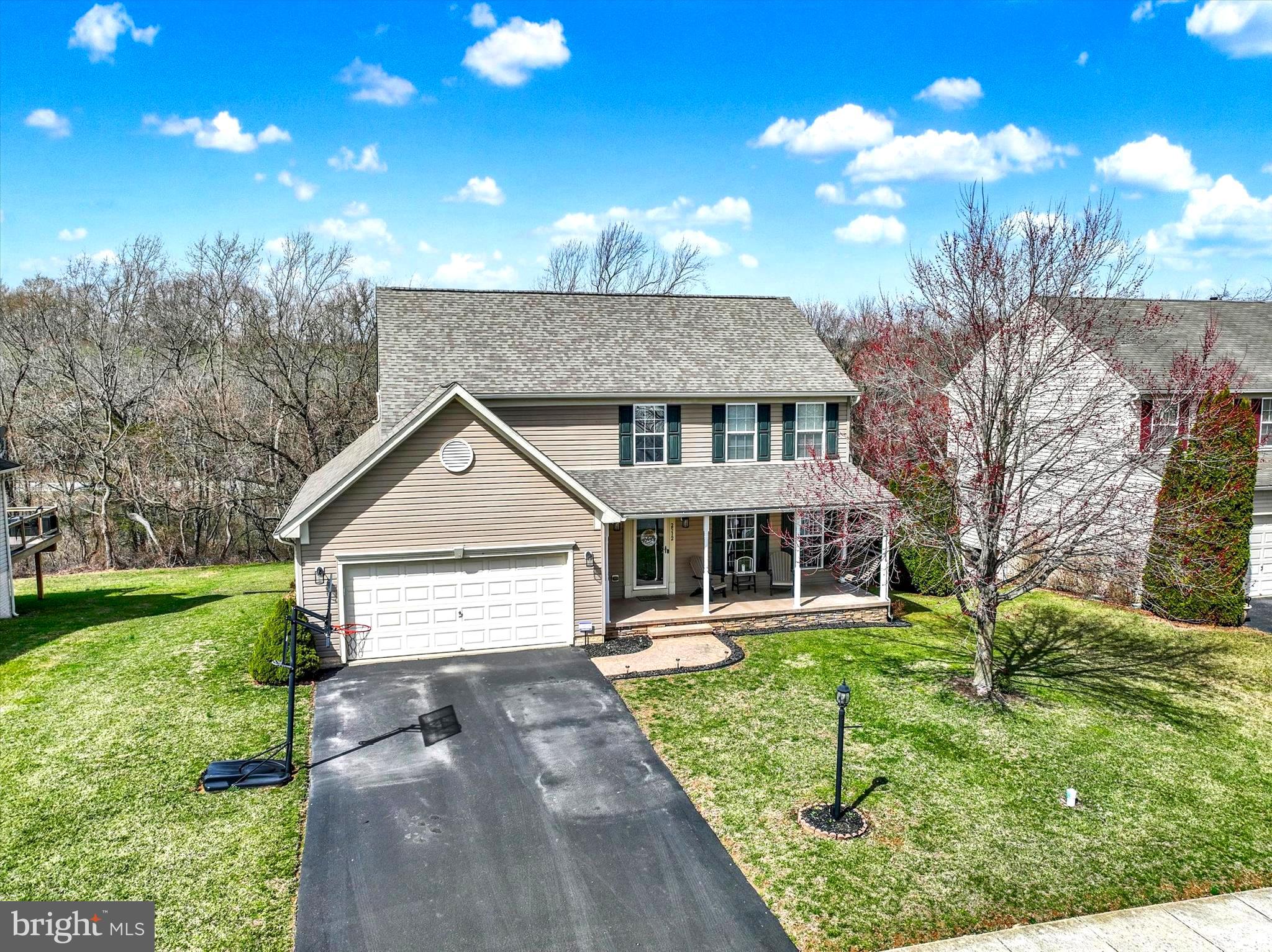 Introducing 2512 Codorus ln. If you have been searching for a lovely home that has been updated and well maintained, look no further! This home offers an open concept entertaining layout with over 3,000 total finished sq ft of living space. Nestled in the beautiful Codorus Estates neighborhood within the Southern York County School District. Surrounded by picturesque farmland and just minutes from the popular Codorus State Park—where you can enjoy hiking, boating, swimming, camping, and a wealth of outdoor activities—this location offers both tranquility and convenience, with shopping and dining nearby. As soon as you pull into the driveway, you’ll recognize the care and quality that has gone into this property. Some key updates include: a new roof completed in 2019, a fully renovated kitchen in 2020, and a new hot water heater in 2023. Exploring the exterior of the property, you'll be struck by the well-appointed landscaping that enhances its curb appeal. The rear yard backs up to trees offering peace and tranquility with plenty of wildlife to view. The charming front porch leads you gracefully into the home. The home boasts 4 generously sized bedrooms, 2 full bathrooms, and 1 half bath, along with a fully finished lower level. The foyer welcomes you and your guests. To the right, the front living room —a perfect spot for reading or relaxation. Continue to the spacious formal dining room, ideal for hosting holiday meals and gatherings. The kitchen and great room, both accessible from the foyer or dining room, form the heart of the home. The spacious, updated kitchen showcases stainless appliances, abundant cabinetry, and a generous L-shaped granite center island. The island is ideal for entertainment and food prepping while you're enjoying a glass of wine. The kitchen is open to the great room boasting a striking fireplace providing the perfect amount of ambiance for any occasion. The adjacent sunroom/breakfast room is bathed in light and offers a wonderful space for morning meals or relaxing watching the wildlife. French door doors provide easy access to the backyard, making it an ideal space for entertaining year-round, whether for holiday gatherings or grilling. For added convenience, a half bath, laundry room and garage access are found on the main floor. Upstairs are the 4 bedrooms and 2 full baths. The primary suite features a luxurious bath and an impressive walk-in closet. The finished lower level is a standout feature, offering a versatile space perfect for entertainment. The lower level is ideal for movie nights, game playing, or quality family time. With its thoughtful design, modern updates, and peaceful surroundings, 2512 Codorus ln is a home that promises comfort and joy. Come and experience a place where lasting memories are made and cherished.