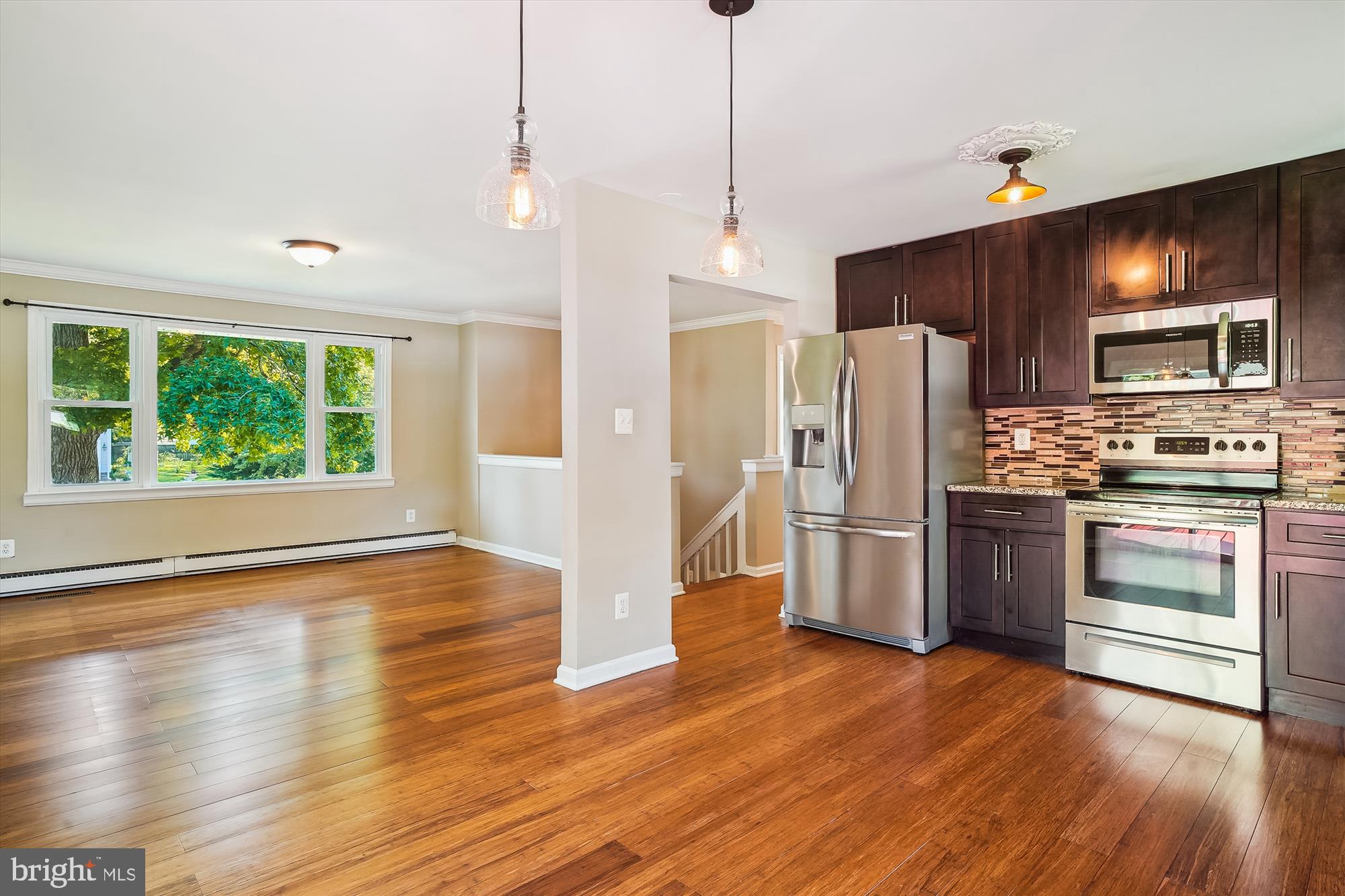 Please NOTE: NEW ROOF is being installed in the next week. Welcome to this beautiful 4BR, 2BA home, renovated in 2017/18 and thoughtfully maintained since! All major systems and items were replaced during that period, including HVAC, water softener/filtration system, water heater, windows, etc., offering peace of mind and move in ready convenience. Step inside to find fresh paint and newer flooring throughout, creating a bright and welcoming atmosphere. The home offers three distinct living spaces, providing incredible flexibility for everyday living, or working from home. Upstairs, the heart of the home features a spacious kitchen with granite countertops, rich dark cabinetry, and stainless-steel appliances. The kitchen flows seamlessly into dining space and out onto a generous deck, perfect for morning coffee or hosting a cookout. Just off the dining space, the living room showcases a wood burning fireplace and great number of windows allowing natural light through. Down the hall are three well sized bedrooms and a full bathroom. Downstairs, the primary suite offers privacy and comfort, complete with its own bath and access to two additional living areas, plus a second fireplace, perfect for cozy evenings. A great size laundry room adds extra convenience on this level. Step outside and discover a covered porch beneath the deck that offers a shaded, bug-free retreat. The expansive backyard is the star of the show, ideal for entertaining, pets, kids, or your dream garden. With raised garden beds already in place, your green thumb will feel right at home. Kent Island Estates is a lovely community that hosts gatherings of all sorts. Down the road you will have access to the Romancoke Fishing Pier, South Island Trail, Clubhouse, Playground. The community also has lovely beaches to hang out. This is the one you’ve been waiting for, schedule your private tour today before it’s gone!