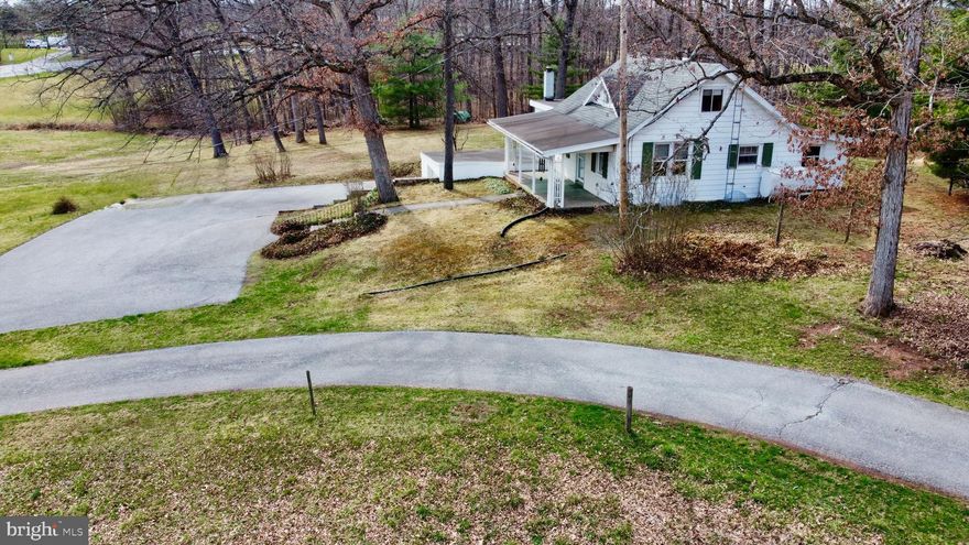 This charming Cape Cod home is situated within the Northern School District. It features two bedrooms on the first floor and a third bedroom with new flooring on the second floor.  The kitchen has an electric range, dishwasher, refrigerator, and window unit a/c.   There's a formal dining room that provides access to the upper level. The living room is cozy, and the full bathroom includes a tub/shower.  The first-floor laundry area consists of the washer.  The included Dryer is located on the Lower Level.   You'll find plenty of storage space downstairs and a workshop room. The property consists of a one-car garage set on 1.54 acres in a picturesque setting.