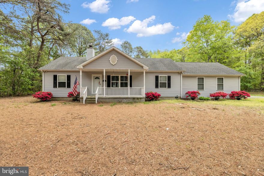 This comfortable rancher with a large above-ground pool with direct access to sunroom and into the home without getting feet dirty (yeah)!  Roomy kitchen and open floor plan allows large gatherings to enjoy the roominess.  Working wood-burning fireplace is great for use to heat home all winter or just on-call use when you want the ambiance.  Convenient mudroom off garage with washer and dryer on into the kitchen with the pantry next to mudroom for convenience.  Large counter seats 4 comfortably.  Dining area for full-size table and chairs.  Large two-car garage with overhead door and remote controls and shelving for storage.  Full-size attack with flooring to use for storage.  Two large outback sheds for many uses including a craft shop, carving shop, etc.,; one is complete with a pellet stove for cool/cold days or evenings.  All of this and more comes with privacy and deeded walking rights to the dock/pier at the end of the lane.  Perfect to just relax and enjoy the water or to crab/fish.  All this comes with 3 acres of "home" written all over. Schedule your appointment today while it is still available.