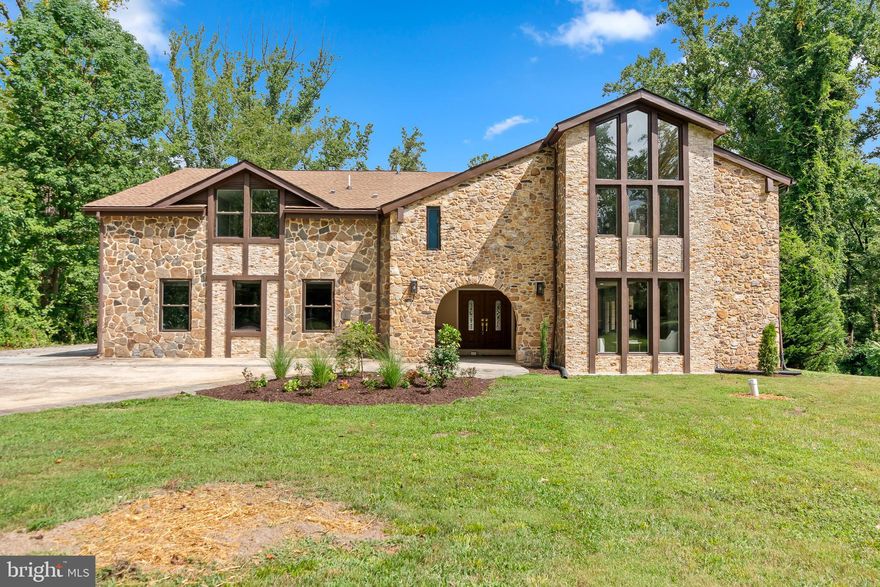 *****Brand new Culligan Water Softener system Installed*****
Exquisite 7,633 Sq. Ft. Stone Front Estate on Over an Acre with Water Access & Resort-Style Amenities
Wake up to the peaceful sounds of nature and end your day with breathtaking sunsets from your private balcony in this beautifully renovated 7,633 sq. ft., 6-bedroom, 5.5-bath stone front estate. Set on over an acre in the coveted Saefern neighborhood, this home perfectly blends elegance, comfort, and a one-of-a-kind waterfront lifestyle.
The grand foyer greets you with a sparkling chandelier and exquisite tile flooring, flowing into a gourmet kitchen with natural wood cabinetry, stainless steel appliances, a spacious island, and a cozy breakfast area with matching countertops. The open-concept family room invites connection and entertainment, while formal living and dining rooms showcase rich hardwood floors. Upstairs, cathedral ceilings crown the bedrooms, three with private en suites, including the primary suite with a spa-like bath and balcony views of the sunrise and sunset. A conveniently located upstairs laundry room makes everyday living effortless. Refinished hardwoods span the entire upper level.
The expansive finished basement offers a wet/dry bar and a versatile bonus room—ideal for a home theater, gym, or even a bowling alley. Outdoor living is just as impressive, with a large deck overlooking a picturesque backyard. The oversized 3-car garage and extended driveway provide parking for up to 11 vehicles.
Enjoy exclusive Saefern Saddle & Yacht Club amenities, including marina access with deep and shallow water slips, walking trails, horse stable, dog park, fishing pond, outdoor pool, and tennis and pickleball courts. Brand new roof and all electrical, plumbing, and HVAC work were fully permitted, with final inspections successfully passed for peace of mind. Surrounded by the serenity of nature yet minutes from the Severn River, downtown Annapolis, Annapolis Mall, Anne Arundel Medical Center, and Routes 50 & 97, this home offers the perfect balance of tranquility and convenience.