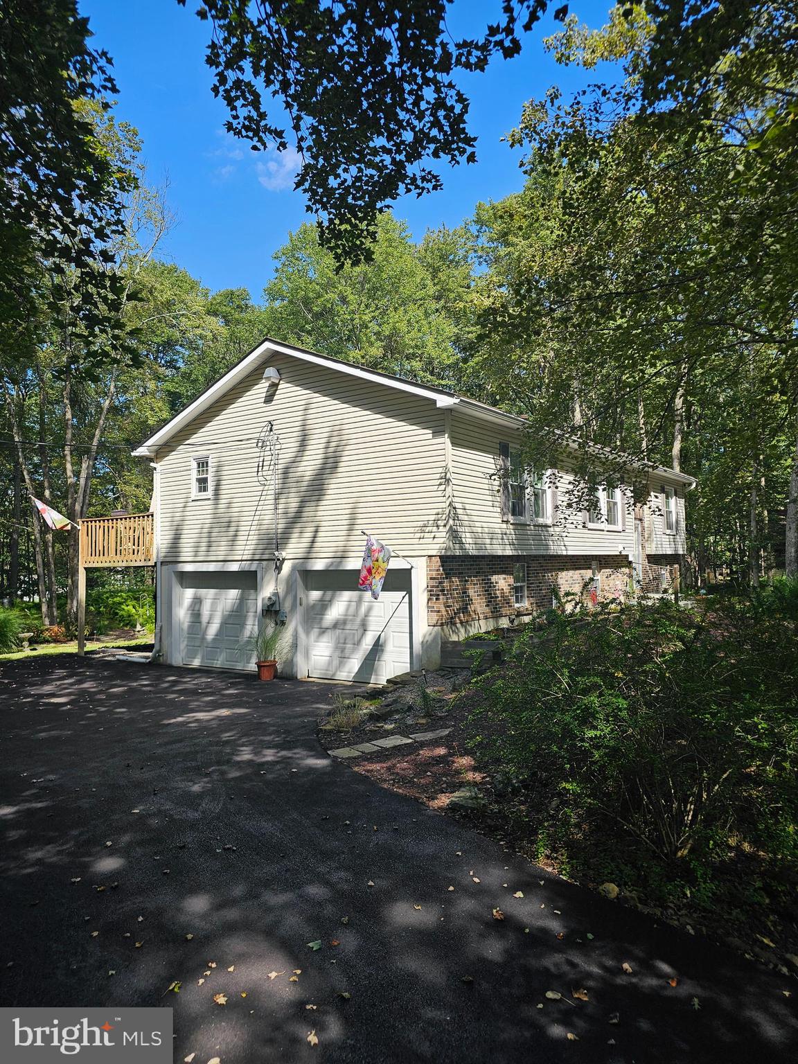 Welcome to this turnkey and fully furnished home located in the secluded Deer Park section of Towamensing Trails community, a Private residential Lake community offering a 190-acre Lake, outdoor pool, sandy beach, tennis, basketball, and volleyball courts. This home has been loved by its 2nd owner for the last 20 plus years, never a rental...However this is a STR Friendly community. The seller is also offering an additional 1.03 Acre corner Lot that is located to the left of the property. This home features 3 spacious bedrooms and 3 Full Baths, Upgraded Kitchen with Granite counters, an attached 2 car Garage, Gorgeous landscaped yard with Decks and a Hot Tub, Water treatment system, Water softener, 200-amp Electric, washer, dryer, and a wood burning fireplace with w blower. Most windows have been upgraded, and a 30-year roof was installed in 2007