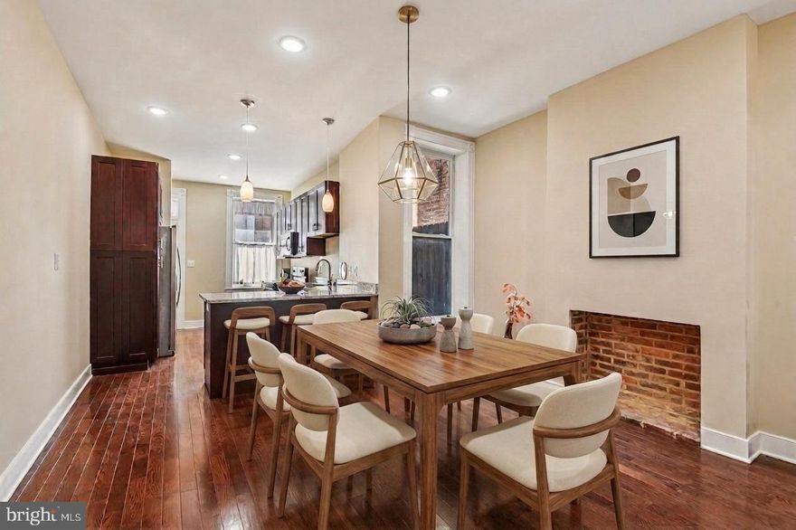 Completely Reimagined and Move-in ready!  Thoughtfully upgraded, this stunning brick-front townhouse offers the perfect blend of historic charm and modern comfort in Baltimore’s vibrant Oliver neighborhood. A home warranty is included for added peace of mind.

Featuring 2 bedrooms and 2.5 baths, the home showcases classic Baltimore character with iconic marble steps, decorative brick fireplaces, and intricate architectural details throughout. Inside, gleaming hardwood floors, recessed lighting, and a striking half-circle arched hallway create a warm yet refined atmosphere. The open staircase overlooks a formal dining area that flows seamlessly into a fully equipped kitchen complete with Whirlpool stainless steel appliances, tall soft-close cabinetry, sleek countertops, a breakfast bar with pendant lighting, and a built-in wine rack.

Upstairs, the spacious primary suite offers a spa-inspired bath and walk-in closet, while the second bedroom provides generous space for other occupants,guests or a home office. A conveniently located upper-level laundry closet adds everyday ease and convenience.

Step outside to enjoy a private, low-maintenance fenced backyard—ideal for relaxing or entertaining. Additional highlights include a full unfinished basement and the comfort of a brand new central HVAC system with a new water tank and expansion tank.

Perfectly positioned for convenience and lifestyle, the home is just a short walk to Oliver Recreation Center, a quick 3–5 minute drive to Johns Hopkins Hospital, and only minutes from National Great Blacks In Wax Museum. This location offers both neighborhood charm and access to some of Baltimore’s most important destinations.

Situated within a strong and supportive community with an active neighborhood association, 1602 N Bond Street offers more than just a home—it offers connection, convenience, and long-term value.  Wait there's more! This Home is eligible for Vacant to Values, Live Near Your Work and several other First Time Home Owner Programs.
Don’t miss the opportunity to make this exceptional townhouse your own!

AI was used to assist with media generation
