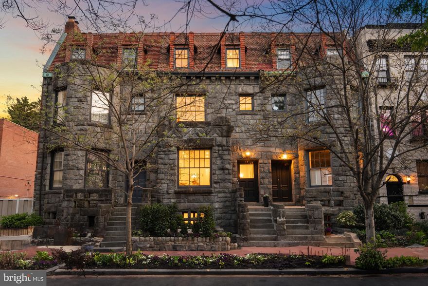 Steeped in history, this remarkable home was originally designed by T.J. Collins, the renowned architect celebrated for his Richardsonian Romanesque buildings. Commissioned by the Noyes family—founders of the Associated Press and later owners of the Washington Star—the residence has long stood as a symbol of legacy and influence.

In a later chapter of its story, the home passed into the hands of the lead architect of Resurrection City, who left his own mark before selling it to the current owners. Today, the space has been thoughtfully reimagined to reflect the lifestyle and design sensibilities of 2025, blending timeless architectural craftsmanship with modern comfort and innovation.

Offered for the first time in over 50 years, this extraordinary 21-foot-wide Gothic Revival row home, built in 1891, spans multiple levels and showcases a masterful blend of historic character and modern design. Original architectural details—including a fully restored staircase and fireplace mantel—are thoughtfully preserved and paired with curated contemporary finishes for a truly timeless living experience.

Enter into a grand center hall gallery with a curved staircase that sets the tone for the home’s elegant scale and flow. The versatile floor plan features a formal salon ideal for entertaining, a lounge-style kitchen area, and a separate south-facing dining room that comfortably seats ten.

The chef’s kitchen is a true showpiece, featuring a 48" dual-fuel AGA range with three ovens, a full Thermador appliance suite, integrated stone sinks throughout, Brizo plumbing fixtures, and custom herringbone floors. The attention to detail continues with bespoke art moldings that elevate each room.

The upper levels host two distinct primary suites. The expansive main suite offers nearly 500 square feet, including a bright sitting room with southern exposure. The secondary suite features its own private terrace with views of the iconic Scottish Rite House of the Temple. Two additional bedrooms, a home office, and a laundry room—with a deep wash basin—complete the upper floors.

The lower level includes a welcoming family room, powder room, and a covered bluestone porch. A separate guest suite provides flexibility for visitors or can serve as a catering and staging space for large-scale entertaining. There's also the possibility of an income-producing unit, offering added versatility.

Step outside to a tranquil rear patio, where original inlaid brick and over 30 years of mature ivy create a lush, private retreat. A rare bonus: private two-car parking at the rear of the property, completely hidden from view—an exceptionally rare feature in Dupont Circle.

Just a 10-minute walk to both Dupont Circle and Logan Circle, 5 minutes to the vibrant intersection of 17th Street and Q Street NW, and located within the Ross Elementary school boundary

This is a home that defies comparison—an architectural jewel with substance, soul, and style.