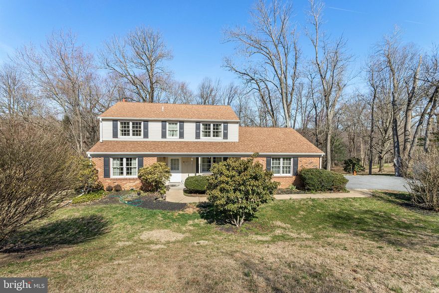 This gorgeous center hall colonial home in the desirable community of Penns Grant has one of the best backyards on the entire street overlooking a natural preserve.  Enter the driveway of this 4 bedroom, 2.5 bath home and notice the manicured front walk to the main foyer entrance.  Once inside, the large living room sits to your left with inviting plush carpeting and tons of natural light.  The formal dining room to the right of the center hall has hardwood flooring and pendant chandelier.  At the back of the home is an open and bright space with spectacular views of the deck and yard.  Family room area with recessed lighting, hardwood flooring and a cozy fireplace is the perfect place to view the outdoors through the oversized three panel picture window.  Spacious updated kitchen includes granite counters, new elite stainless steel appliances ceramic tile flooring, wooden cabinetry, center island workspace, separate breakfast bar area with extra storage, a lighted ceiling fan and access through a sliding door to the deck.  Just off the kitchen sits a mudroom with half bath, laundry facilities with new Kenmore washer and dryer, and access to the garage.  A sun porch leading to the driveway from here is the best place in the house to sit and enjoy a cup of coffee.  Upstairs the Master Bedroom is complete with hardwood flooring, an updated en-suite master bath, a large closet and additional built in cabinets.  Three additional bedrooms on this floor also have copious closet space and hardwood flooring.  Hall bathroom with ceramic tile surround completes this floor.  Partially finished walk-out basement includes lots of additional living space as well as a ton of storage.  Outside, the huge level backyard with shade making mature trees has limitless potential. This home has a brand new driveway, updated HVAC and water heater with warranty, newer dimensional shingle roof.  Unlike most homes in the neighborhood, this property has been tied into public sewer service.  Close to rte 1 and rte 202 shops and restaurants.  Located between PHL Int l airport and Wilmington, DE in the sought after Garnet Valley School District.