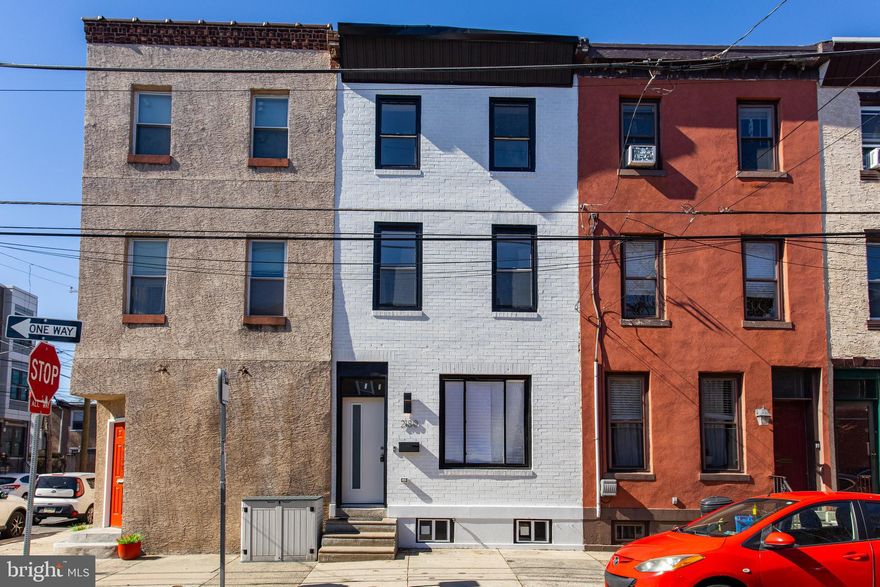 Welcome to 2180 E. Cumberland Street, a beautifully renovated 3-bedroom, 3.5-bathroom townhome located in the vibrant heart of Fishtown, Philadelphia. This home boasts modern updates throughout, offering a perfect blend of comfort and style. As you enter, you'll be greeted by stunning luxury vinyl plank flooring that flows seamlessly throughout the home. The living room features an electric fireplace and an exposed brick accent wall, adding both warmth and character. From the living room, you'll step into the spacious dining area, ideal for gatherings. The chef’s kitchen is a true standout, complete with shaker cabinets, quartz countertops, a stylish tile backsplash, and stainless steel appliances—everything you need to create your culinary masterpieces. A conveniently located powder room with tile floors and a light-up mirror completes the first level, along with a rear mudroom for added convenience. The second level offers two generously sized bedrooms, each with luxury vinyl plank flooring, ceiling fans, and en-suite bathrooms featuring tiled floors, step-in showers, and light-up mirrors. A brand-new washer and dryer are also conveniently located on this floor in the laundry room. The third level is dedicated to the private primary suite, featuring luxury vinyl plank flooring, a walk-in closet, and a luxurious en-suite bathroom with tile floors, a soaking tub, and a double sink vanity—a perfect retreat after a long day. The unfinished basement provides ample space for storage or the opportunity to customize it to suit your needs. Additional features include smart home wiring, an audio system, and brand-new HVAC and water heater systems for your peace of mind. Located just minutes from local restaurants, shopping, and entertainment, this home also offers easy access to I-95, making commuting a breeze. Don’t miss the chance to make this stunning home your own!