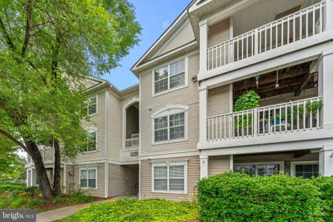 Photo of 11000 Kinship Court #302, MANASSAS, VA 20109 (MLS # VAPW2122982)