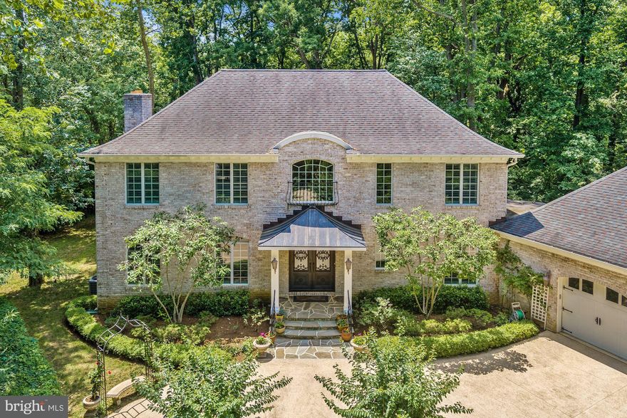 Open house for Sunday 7/19 has been canceled. Annapolis Waterfront. Custom built brick French Colonial on 1.8 acres on Crab Creek/South River. Listed below recent appraisal for $1,350,000 (before New Pier was added).  Bring your boat, new pier with 5' MLW and no bridges to the Bay. Bright open floor plan with high end finishes throughout this modern home including hardwood floors, imported limestone two-story entry foyer, iron double entry front door, 3 piece custom moldings, wainscotting on both 1st & 2nd floors, granite and stainless steel. Gorgeous eat-in kitchen with 6 burner Wolf stove & hood, Sub-Zero refrigerator plus 2 cooling drawers, wine cooler, dual sinks w/garbage disposals, Miele coffee bar, double drawer dishwasher and great view of the water & new pier. Master bedroom features deluxe bath w/steam shower, twin (his & hers) zoned heated floors, twin (his & hers) walk-in closets, hardwood floors, fireplace and balcony overlooking the water. Main level bedroom with private bath. Large 2nd floor laundry room that could be 5th bedroom. Covered back porch overlooking the water, oversized 2 car garage with tons of storage in built-in lockers plus there is an unfinished lower level with ruff-in for full bath. Great location for getting out to Rt 50 & I97 (only 1 stop light to DC) but close to all the activities in Downtown Annapolis. Private and peaceful setting.