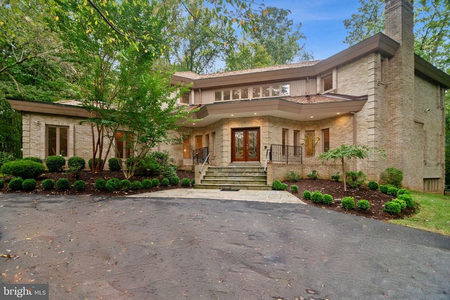 BRAND NEW ROOF! This is a RARE opportunity to own a UNIQUE contemporary home that backs to wooded park-like setting in the cul-de-sac of the prestigious Tara community.  This home exudes warmth and LIGHT with skylights and  windows ideally situated throughout the home.  The gourmet kitchen was beautifully renovated with a sleek European style.  It is smartly joined with the breakfast area which overlooks the backyard patio and huge deck.  Brand new hardwood floors were installed throughout the upstairs and in the main level office.  Main level office could easily convert into a first floor bedroom for main level living.  The Grand Master Suite features its own private balcony,HIS AND HERS bathrooms, his and hers walk-in closets, fireplace, sitting area, steam shower, vaulted ceilings, and more.  The walk-out lower level has its own private patio, guest bedroom, and en-suite bathroom. Additional family seating area with fireplace, brand new high end carpet, game area, workout area, cedar closet, and loads of storage add to this incredibly spacious level.  Three car over-sized garage with rear entry!  Churchill school district and brand new Potomac Elementary due to open in January of 2020.