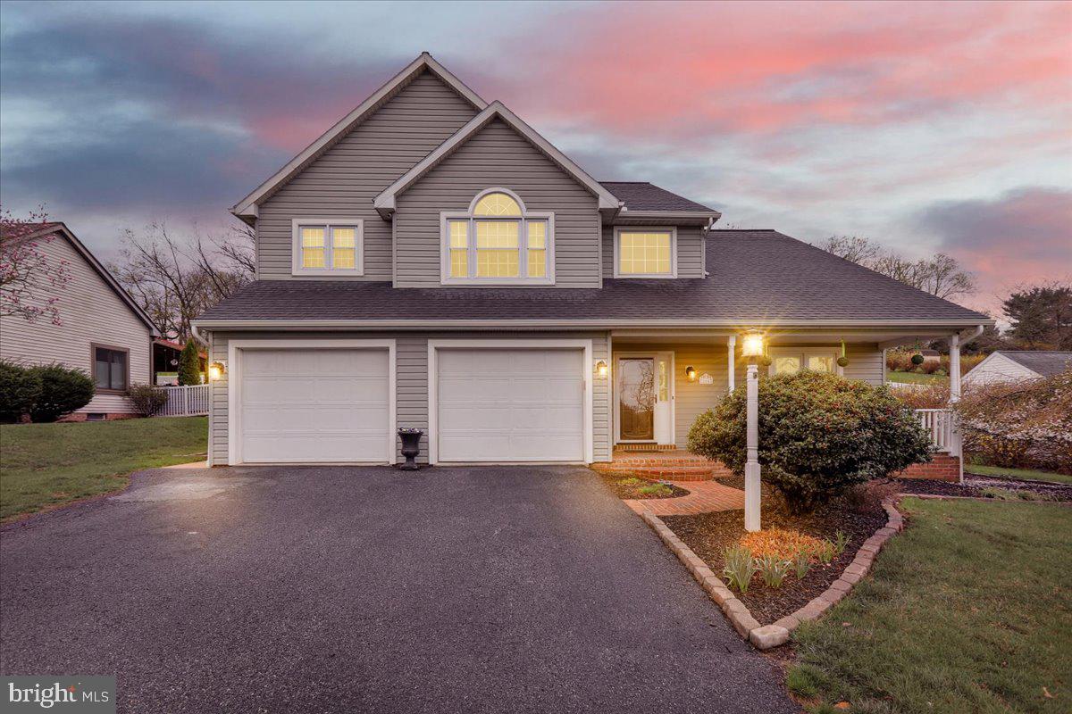 Nestled on over half an acre, this fabulous home offers the perfect blend of comfort and entertainment. Step inside to discover an open floor plan adorned with gleaming hardwood floors, creating a seamless flow throughout the main living areas. The spacious dining room is ideal for hosting memorable dinners, while the kitchen, open to the family room, boasts modern amenities and a cozy gas fireplace, making it the heart of the home. Convenience is key with a first-floor laundry room, ensuring everyday tasks are a breeze. Retreat to the primary bedroom, featuring cathedral ceiling, hardwood floors, a generous walk-in closet, and a spacious primary bathroom. Crafting room or office den space on the upper level is perfect for all of your creative ideas. The finished lower level is an entertainer's paradise, complete with a bar and a charming reading nook. Outside, the covered patio and inviting in-ground pool provide the ultimate setting for outdoor gatherings and relaxation. This home is truly an entertainer's dream, offering ample space for both intimate and larger gatherings.