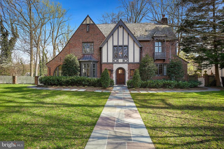 Significant price adjustment!!  Built in 1927 this classic, timeless Tudor is located on one of Washingtons most coveted streets  and sits on two lots totaling almost 30,000 sq ft. This 6,000 sq ft home (5400 main home, 640  accessory) has been impeccably updated yet retains the charm of a bygone era!  Enter into the the large limestone foyer with original mahogany wood arches, maple inlay floors  and grand original wood 2 story staircase with leaded glass windows.  The gracious beamed living room with fireplace & high ceilings leads to a large sun room with a wall of windows with gorgeous vistas. The large formal dining room and butlers pantry  with storage and bar area perfect for entertaining. The  eat-in chef's kitchen with oversized island, quartz countertops, custom hood, hand cut marble and glass backsplash & high end appliances opens to the family room and deck. 
The large primary suite has  luxurious en suite bath with two vanities and soaker tub , walk in closet, office/exercise room and balcony.  There are 2 additional bedrooms and a full bath on the 2nd floor. The finished 3rd level has an additional bedroom, a full bath and an "art room" flooded with natural light.
The full size lower level with recreation room with built-ins, large light filled playroom, bedroom,  full bath and large laundry area.
The guest house accessory dwelling has a living space, kitchenette, bedroom and full bath .  
One car garage with alley access..
Multiple outdoor spaces- deck, balcony and patios.
Conveniently located in the Forest Hills neighborhood, steps to Rock Creek Park & Connecticut Avenue shops and restaurants.
There are two separate lots with this property: The house sits on lot 47 with 11,973 sq ft;  the second 
lot 48 totals 17,702 sq ft   
Please see disclosures 
Floor plans found in document tab