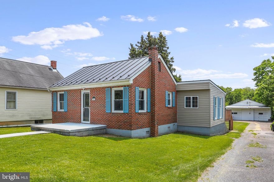 Unrestricted and NO HOA!! Price reduced to below appraised value. Incredibly charming brick rancher offers the convenience of city living combined with a quiet community feel. On the North end of town just off of Rt 11 in the Spring Mill's School District. This wonderfully maintained home offers 3 bedrooms, 1 nicely renovated bathroom. Tile floors throughout most of the house with hardwoods in the dining room and carpet in the bedrooms.  A new Standing Seam roof was installed in Dec 2018 and a new central AC unit in June 2019. The washer and dryer and extra refrigerator are located in the basement. There is a two tiered deck out back with a large yard (just under 1/2 acre) that backs to trees.  And...don't forget the Large 30x30 detached garage (with private driveway) that sits directly behind the house. This garage boasts two large bay doors, security lighting and has its own electrical service. Great for anyone wanting their own secure parking/workshop/man cave/extra storage/gym or whatever use you may see fit. Call to schedule a showing.