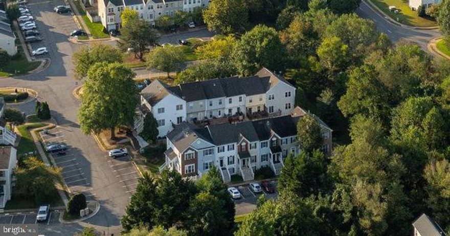 This is your chance to own a sophisticated & spacious three-story townhouse with over 1500 square feet.  This TH was completely remodeled at the end of 2025 by the seller who loved this home for 23+ years.  When I say completely remodeled, I mean all bathrooms, kitchen, floors, carpet, paint and fixtures are brand new, & on-trend, yet still timeless.  The house is essentially in model home condition & even the major systems were replaced less than five years ago.  The main level is an open floorplan with contemporary charm.   When you step into the foyer you are greeted with luxury vinyl flooring as far as the eye can see & walls of windows, many with green dense treelined views.  These trees are far enough away to get sun, but close enough that you see nothing but nature!  The leafy panorama at the front of the house is truly one of the most unique features of the home!  The remodel was not a flip & the quality is exceptional.  This townhouse has two full bedrooms on the upper level, each with its own private bathroom & the lower level/recreational room has a large egress window & walk-in closet that can be used & is advertised as a flex space 3rd bedroom.  The brand-new gourmet kitchen with timeless beautiful Mythic Blue/Navy Blue Shaker cabinets exudes a contemporary charm yet is classically elegant. Stainless Steel appliances with a luxury refrigerator.   A coffee bar & pantry were added so storage is easy!  The white Quartz countertops are a crisp & a classic pairing to the calming cabinets. These beautiful countertops are just the right pop any kitchen needs!  The bathrooms are equally stunning with Quartz countertops on top of brand-new vanities and bathroom tiles and fixtures.   The carpet on the upper level is the chef’s kiss to the entire remodel.  The carpet is thick & dense and will cushion your every step. The paint throughout is neutral & brand new.  The lower level advertised as the 3rd bedroom has a gorgeous fireplace, bright sunny window, large walk-in closet, rough in for 3rd full bathroom & is the best flex space ever!  Keep it as a bedroom or make it the best hang out ever!  The oversized separate laundry room is on the lower level.  Southlake at Montclair is a part of Montclair so boating, fishing, beaches and fun are your amenities & practically right at your doorstep.  It is the most vibrant community with exclusive lake access for boating, kayaking, swimming or lying on any of the several beaches.  All 2” faux wood blinds in white are new as well as most lighting and plumbing fixtures.  Brand new architectural roof in 2025.  Two assigned parking spaces + ample visitor spots!  TH situated at the end of a cul-de-sac around the corner facing the trees.  The Trex deck is fantastic!