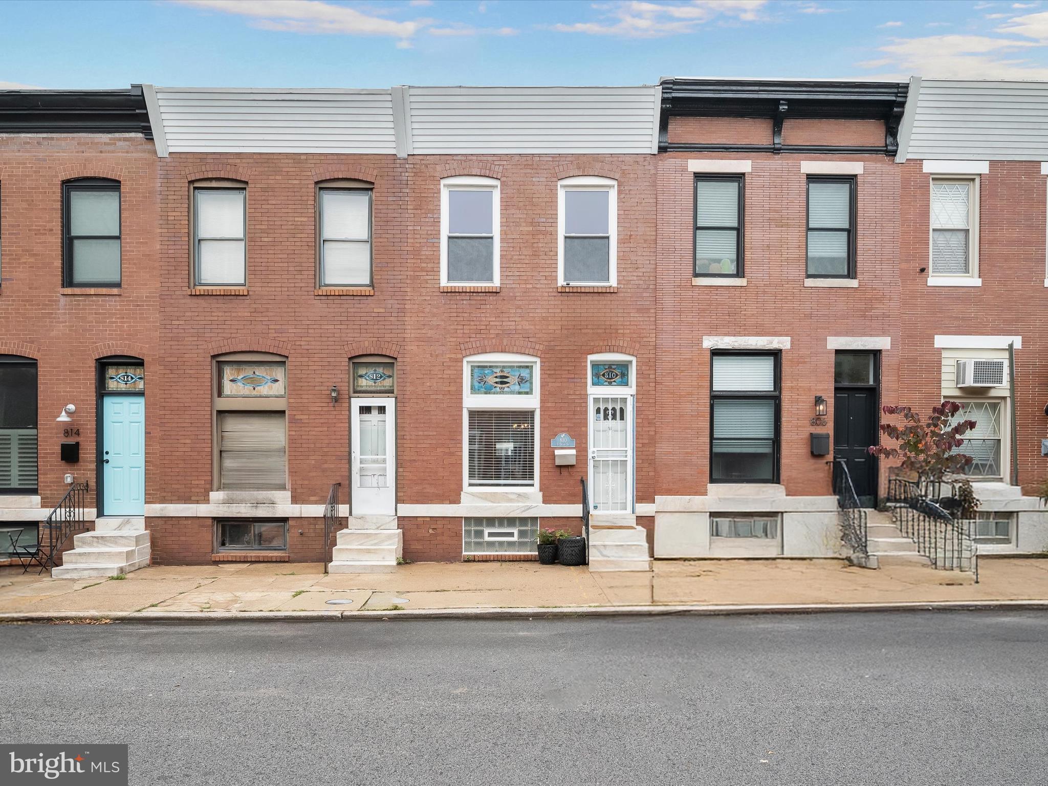 Located in the heart of the vibrant Brewers Hill neighborhood, this two bedroom, two full bathroom row home blends classic charm with modern updates. An open concept main level showcases hardwood floors with elegant border inlays that flow through the living and dining areas. The kitchen is thoughtfully updated with stainless steel appliances, granite countertops, a tile backsplash, and a built-in corner cabinet. Upstairs, the primary bedroom suite offers a walk-in closet and private bathroom with a tub shower. A second bedroom and full bathroom with walk-in shower complete the upper level. Downstairs, additional living space awaits in the finished lower level with a versatile recreation room and laundry. Step outside to enjoy the large fenced patio, perfect for relaxing or entertaining in a private outdoor setting. Some images have been virtually staged.