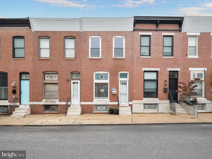 Located in the heart of the vibrant Brewers Hill neighborhood, this two bedroom, two full bathroom row home blends classic charm with modern updates. An open concept main level showcases hardwood floors with elegant border inlays that flow through the living and dining areas. The kitchen is thoughtfully updated with stainless steel appliances, granite countertops, a tile backsplash, and a built-in corner cabinet. Upstairs, the primary bedroom suite offers a walk-in closet and private bathroom with a tub shower. A second bedroom and full bathroom with walk-in shower complete the upper level. Downstairs, additional living space awaits in the finished lower level with a versatile recreation room and laundry. Step outside to enjoy the large fenced patio, perfect for relaxing or entertaining in a private outdoor setting. Some images have been virtually staged.