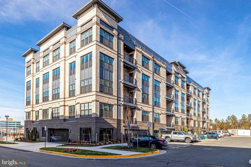 Bright TOP FLOOR CORNER PENTHOUSE unit within walking distance of the new Silver Line Innovation Metro Station.  This better than new CONDO features a gathering room/dining room with plenty of room for entertaining.   This is a  Pulte Ava model, with over $50K in upgrades, includes a Gourmet Kitchen,  designer master bath and no neighbors on three sides.   The beautiful owner's suite has a large walk-in closet &  private hallway. There is an extraordinary amount of room for clothes, shoes & storage. Unwind at the end of the day in your luxury owner's bath. You will love coming home!  Enjoy the view of wildlife --including foxes, rabbits and deer -- from your comfy balcony.  There you can also enjoy breakfast and later cocktails on your bistro set surrounded by your favorite plants!  Home Includes two deeded assigned parking spaces, one in the garage, steps from the elevator and one in the adjacent parking lot.  The Community includes a dog park, tennis courts, basketball, tot lot, rec fields & more. Nearby are more than seventy-five restaurants & shops.  Reston Town Center is just 4 miles away with plenty of shopping and great places to eat.  Remainder of builder 2yr and 10yr warranties.  All appliances have a manufacturer extended warranty through 12/2/2027