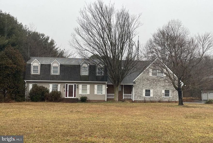 Lots of space in and out here!  Come tour and take it all in to plan your vision with a renovation. Home and detached garage located on over 2 acres of land.  Front door opens into a vast living area despite defined rooms this main level feels open concept.  Also has that first floor bedroom everyone wants/needs. This great property is ready for a 2026 remake!  Property strictly sold as is.  Plenty of storage or convert to living or hangout space above garage.