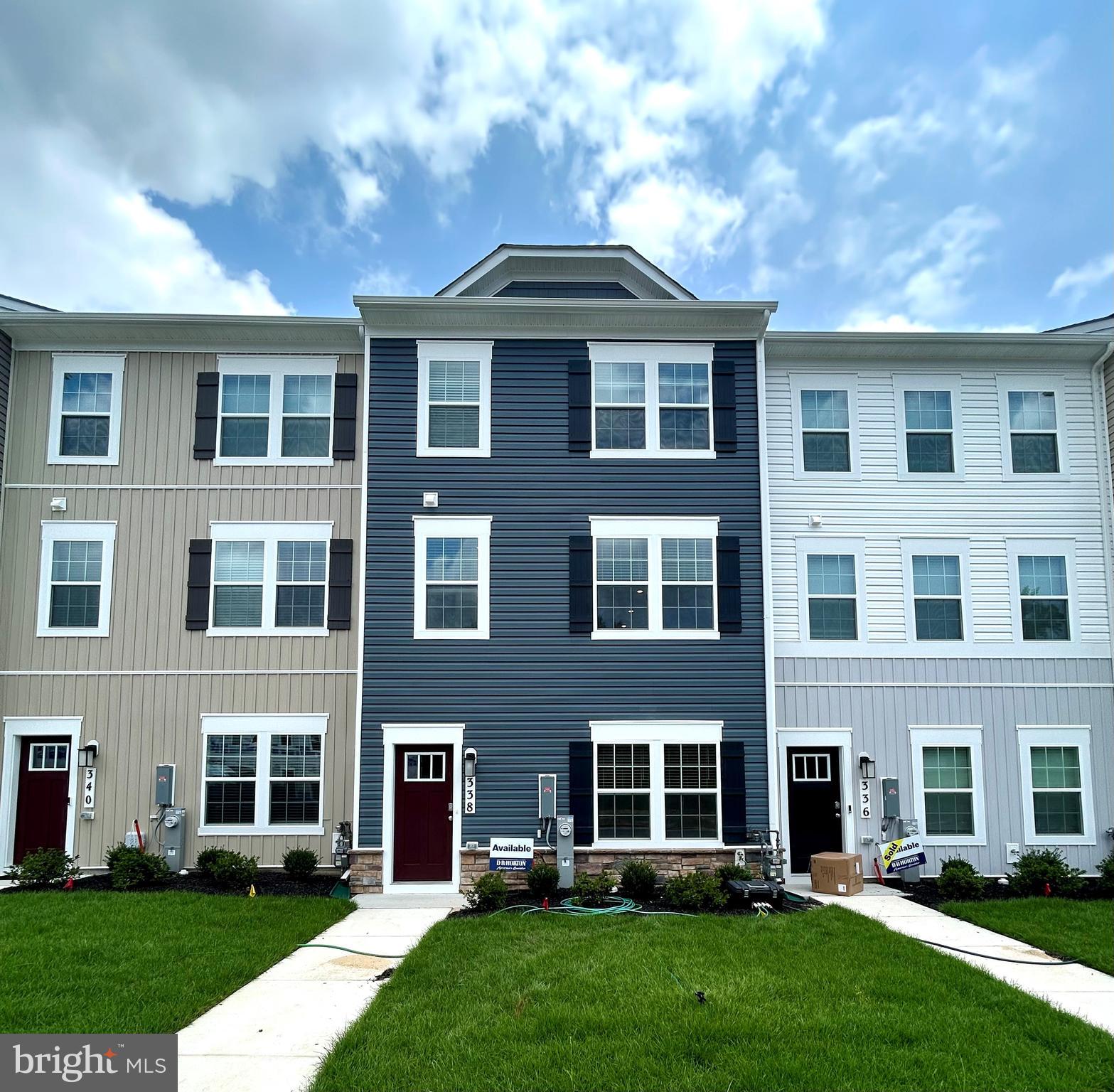 IMMEDIATE MOVE-IN READY! Discover the sophistication of this newly built townhome at Magnolia Landing. The Columbus floor plan perfectly merges the luxury of single-family living with the ease of low-maintenance upkeep. Find your dream home at Magnolia Landing! This breathtaking 3-bedroom, 2.5-bath residence features a 2-car garage with remote access and a welcoming open layout. The heart of the home boasts a gourmet kitchen, complete with a 10' island. The main level highlights 9-foot ceilings and a chef's kitchen equipped with white cabinetry, stainless steel appliances, quartz countertops, and a generous peninsula island. Entertain on your optional rear deck while enjoying the convenience of a powder room. Upstairs, you will find three beautifully appointed bedrooms, a hall bath, and laundry hookups. The owner's suite serves as a true sanctuary, featuring a walk-in closet and a lavish spa-like bathroom with dual vanities. Seize this exceptional chance to own a move-in ready townhome that seamlessly combines modern comfort with thoughtful design and amenities.