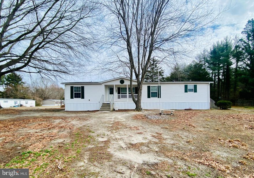 ** This Home is Move In Ready!   It has been Newly Remodeled,  offering  3 bedrooms and 2 full baths.   The Large Kitchen offers New Appliances, ceramic tile edging, and a center island.   The Primary Bedroom offers 2 closets and ensuite, 2 vanities, a soaking tub and walk in shower. This home also features 8' ceilings, thermopane windows, brushed nickle faucets, upgraded light fixtures and doors, new LVP flooring, New Carpeting, New Shutters, New Skirting, Cove Trim, Basboard Trim and  even New Blinds.  There is a beautiful  wood burning fireplace to create a relaxing ambiance in the living room.  This home sits on a large lot and comes with a shed for storage.  ** Park Approval is Required **