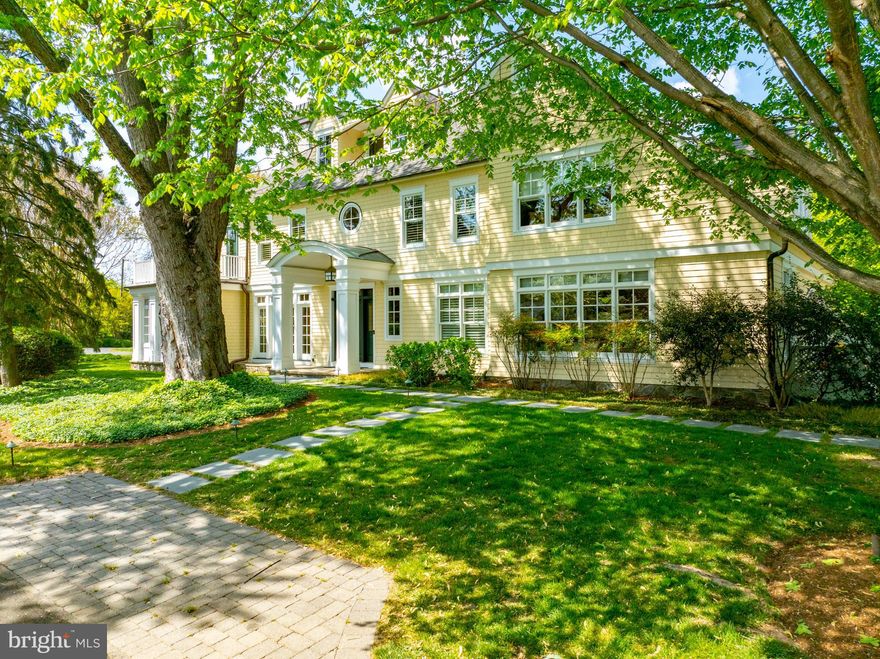 A coveted residence, beautiful grounds and lap pool located in Pendennis Mount offers a unique opportunity for any Buyer seeking a signature, spacious, elegant, shingle style home. This well maintained 5 Bedroom, 4 full, 2 half bath home was designed by Boggs and Partners Architects and built by Lundberg Builders in 2002. Boasting over 6500 sq. feet of living space, the interior is warm, well-proportioned, and beautifully detailed, easily accommodating large interior gatherings. Three sets of French Doors from the screened porch, dining room, and kitchen open the home to exquisite and magical exterior spaces. This private oasis within a wonderful neighborhood includes a large ipe veranda featuring a custom height pergola and stone planter, a bluestone patio, and intimate circular fire pit space, all perfect for entertaining. Bluestone paths lead to a lap pool (with fountains), hot tub, and a gathering spot between a pair of matching pool house structures. This space includes a fireplace and outdoor shower. Established specimen plantings and trees.
The home offers four finished levels of living space. An upper floor, featuring a pool table, bar, balcony and half bath, provides great space for watching sports or enjoying a “tree house” feel. The bedroom level includes a spacious primary suite with office, walk in closet, gas fireplace, and private bath, as well as three additional bedrooms, two full baths, laundry room and ample linen storage. The main level features wide plank mahogany floors, extensive millwork and built-in storage, coffered ceilings, and two fireplaces. This floor includes a bedroom suite, spacious living and family rooms, a gracious dining room, screened porch, custom eat-in kitchen, pantry, and mudroom. The lower level includes an exercise room, and recreation/TV space. Oversized, attached, two car garage. Fabulous location within Annapolis, minutes to downtown across the Naval Academy Bridge, dining, shopping, biking the B & A trail and easy access to Route 50.