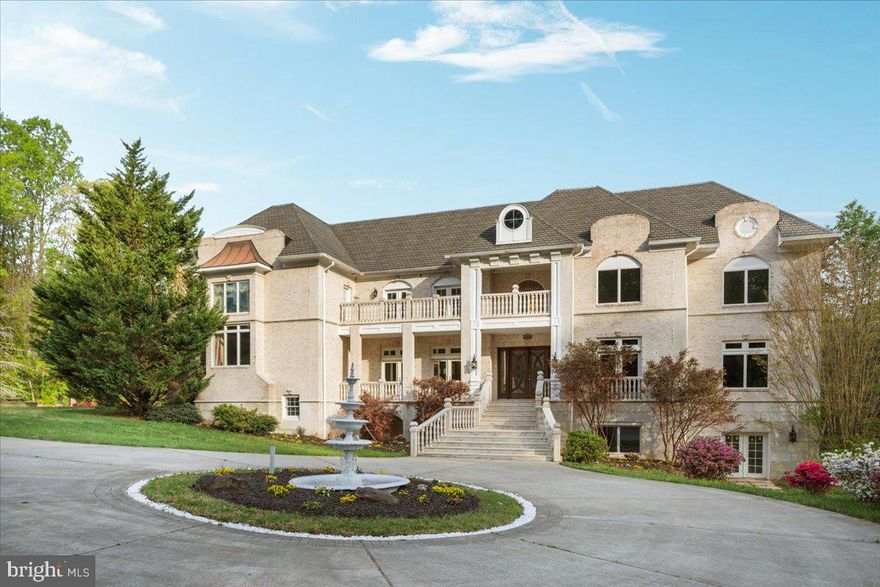 This extraordinary manor manages to do the impossible: it offers over 17,000 square feet of architectural brilliance while maintaining the warmth and intimacy of a true family home. While the scale is undeniably grand, the floor plan is a masterclass in human-scale design, prioritizing an unhurried flow and everyday livability. From the moment you arrive, the imported Spanish railings and brick-and-granite façade establish a sense of enduring quality, yet the layout ensures that the first impression is as inviting as it is stately.

The brilliance of the interior lies in its intentional proportions. While the formal spaces command attention with soaring 20-foot ceilings and towering walls of glass, the home never feels cavernous. Rich Brazilian Cherry hardwoods anchor each room, creating a grounded atmosphere that balances the dramatic volume of the formal living and family rooms. Here, the architecture invites natural light to fill the space, ensuring that even the most impressive rooms feel airy and inherently comfortable.

The primary suite is a true sanctuary, spanning over 1,750 square feet to offer a private wing for total decompression, complete with a sitting area and a spa-inspired bath including a steam shower, dual vanities & deep jetted tub. 

A grand beautiful office overlooking the front yard greets you just off the foyer.

At the heart of the home, the kitchen and family room transition seamlessly for a layout designed for true connection. Though equipped with pro-grade Wolf and Dacor appliances for serious entertaining, the space remains centered on daily life, featuring a generous breakfast room and a built-in coffee station for slow mornings. Thoughtful touches like a fireplace in the mudroom—one of five throughout the estate—ensure that even utilitarian transitions feel cozy. This wing also includes a dramatic two-story library, topped by a dedicated art gallery that keeps the home’s creative spirit visible and accessible.

The upper levels prioritize the luxury of space and privacy, connected by extra-wide hallways that make moving through the home feel effortless. Each secondary bedroom is a full suite with its own private bath, and three feature granite balconies for private outdoor escapes. Practicality is woven into this grand design, with laundry facilities on all three floors and an elevator to simplify the logistics of daily life.

The lower level defies expectations of a basement offering a bright, open-concept wellness and entertainment hub that feels like a private club. A 960-square-foot professional gym anchors the wing, sitting alongside a full spa with a sauna and steam shower. With direct access to the private inground pool, the transition between indoor wellness and outdoor recreation is seamless. Between the wine cellar, media room, and multiple recreation spaces, the floor plan provides an intuitive flow for both large-scale hosting and quiet family indulgence.

Perhaps the most comfortable aspect of this estate is the peace of mind provided by its forward-thinking infrastructure. A sophisticated geothermal heating and cooling system paired with solar panels allows the home to operate with incredible efficiency, keeping average monthly utilities under $300. It is a rare achievement to find a residence that offers the grandeur of a palace with the manageable footprint and sustainable ease of a modern home. This is a generational statement built for legacy, where every square foot is designed to help your life unfold with total ease.  *** Fully Inspected Elevator Shaft in Place - Elevator to be installed prior to settlement