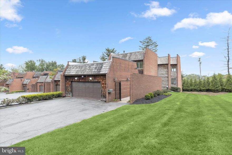 Introducing this charming six bedroom, three and a half bathroom end-unit townhome in the sought-after Stevenson Crossing neighborhood. Offering over 3,800 square feet of beautifully designed living space across three levels, this sun-filled home is one of the largest in the entire community. As you arrive, a gated front courtyard provides privacy and access to the attached two-car garage. Step inside to discover rich hardwood floors and abundant natural light throughout the main level. The inviting living room offers a cozy retreat with a large skylight. Prepare your favorite meals in the updated kitchen that boasts quartz countertops, a tile backsplash, soft-close shaker cabinets, a breakfast bar, and pantry. Stainless steel appliances include an electric range, double wall ovens, built-in microwave, refrigerator/freezer, and two dishwashers for added convenience. Just beyond, the elegant dining room accommodates gatherings of any size and is highlighted by wainscoting, a statement chandelier, and sliding wood pocket doors leading to the impressive family room. Anchored by a gas fireplace, floor-to-ceiling windows, and sliding glass doors, the family room serves as a peaceful retreat. Outside, the rear deck provides the perfect space for lounging or dining al fresco. The main level also includes a bedroom ideal for an office or den, along with a half bathroom down the hall. Upstairs, the primary bedroom suite features a large walk-in closet and a luxurious updated bathroom with a dual-sink vanity, frameless walk-in shower, and linen closet. Three additional bedrooms and a shared hall bathroom complete the upper level. Downstairs, the fully-finished lower level expands the living space with an expansive recreation room featuring sliding glass doors to the patio and rear yard. The sixth bedroom is located on this level, along with a third full bathroom and a versatile bonus room ideal for a gym, playroom, or additional office. A large laundry room with ample storage completes the lower level. Recent upgrades include replaced windows, zoned heating and cooling systems, a new roof, and more. Community amenities include a security gate, outdoor pool, playground, and basketball, tennis, and pickleball courts.