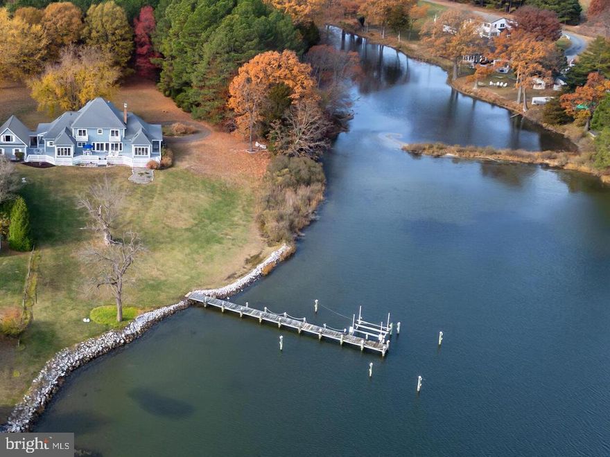 Welcome to this inviting estate set on over 12 acres along the Miles River and Long-Haul Creek.  This 5-bedroom and 4-bathroom home offers breathtaking views, premium amenities, and a private deep-water dock with 8 ft. MLW and a new boat lift (2022) perfect for boating enthusiasts.

The seller is committed to county sewer and fees, ensuring future utility access is in place.  Additionally the property offers plenty of room to add a waterside swimming pool, enhancing its appeal as a luxurious retreat.  With ample space available, there is room to add a tennis court, further elevating the property's recreational offerings.  This estate also presents a promising opportunity for future short-term rental potential, making it an attractive investment.  

The spacious first-floor primary suite includes a sauna, fireplace and sunroom with vaulted ceilings and skylights . Hardwood and ceramic tile flooring throughout create an elegant yet comfortable living environment.

Conveniently located near The Miles River Yacht Club and Inn at Perry Cabin Links Golf Course, this property offers a fantastic investment opportunity in a sought-after location.  Schedule a visit today to experience the charm and tranquility of this exceptional waterfront property.